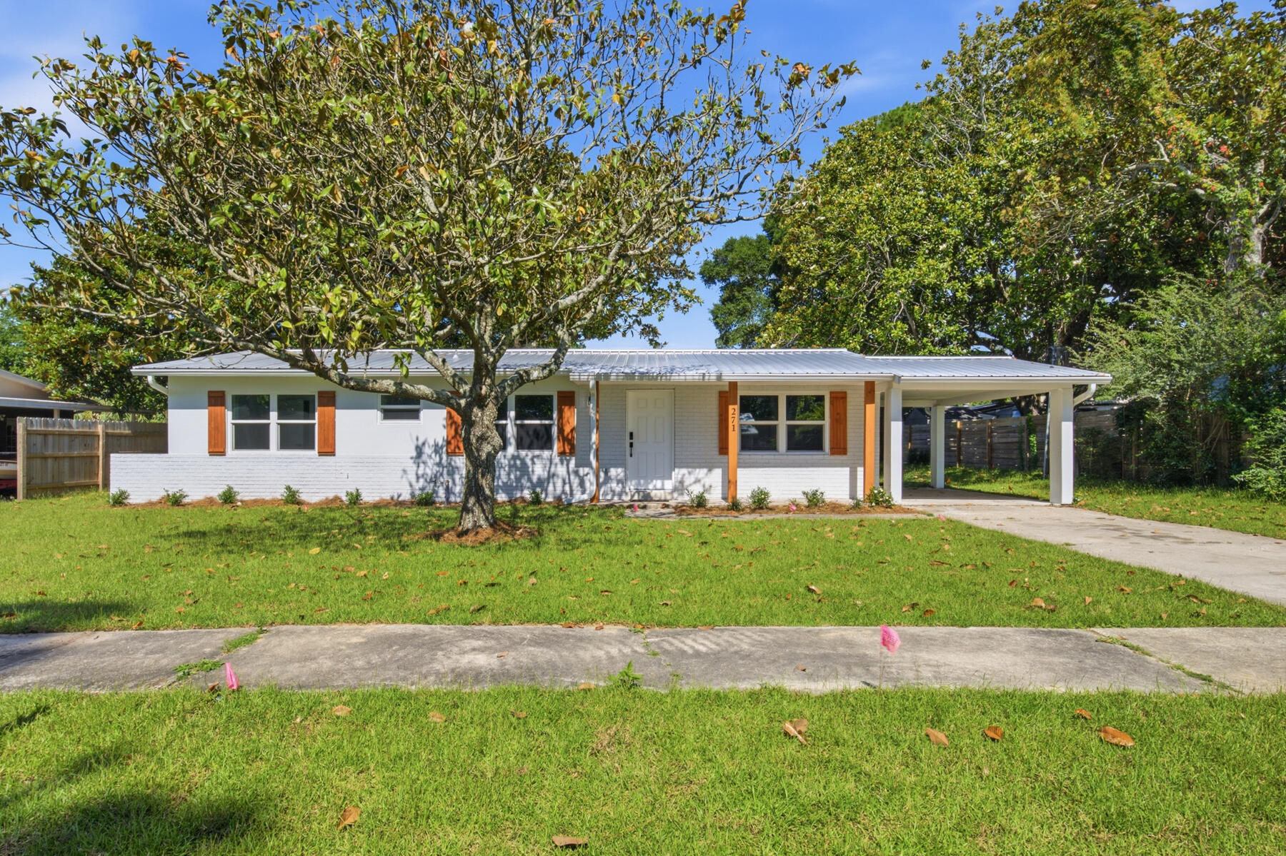 COMPLETELY REMODELED AND GORGEOUS HOME FROM TOP TO BOTTOM! This cute home has just been painted and new carpet installed throughout. It offers a true split bedroom design with two full baths. All appliances are included except washer/dryer. Inside laundry, family room, living room and dining room provide ample room for all. Completely fenced back yard and with one car carport. New heating/AC interior unit installed two year ago. Great location close to schools, mall and Hurlburt.
