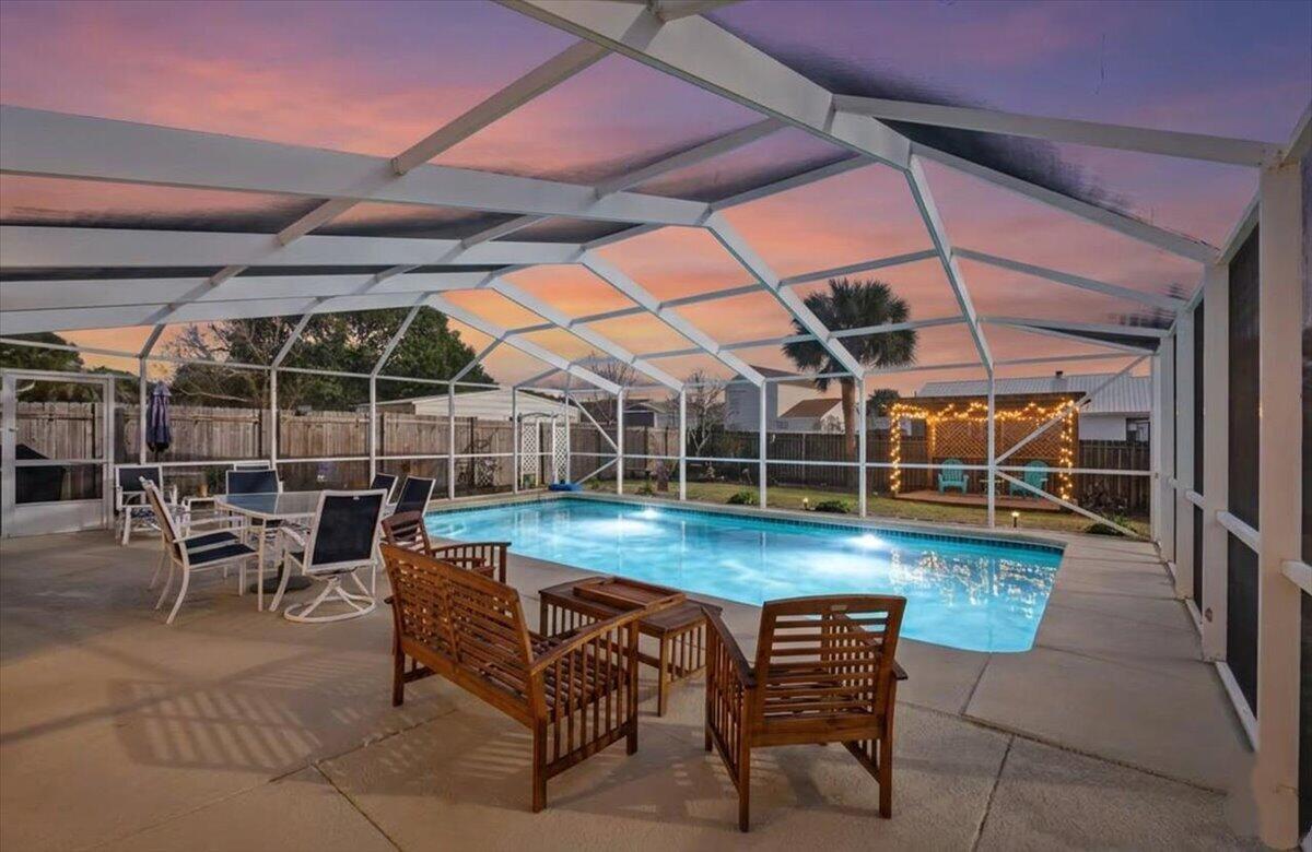 Your private retreat awaits..This beautifully updated pool home blends modern upgrades with everyday comfort, creating the perfect setting for both relaxing and entertaining. From the moment you enter, you'll notice the fresh contemporary feel highlighted by LVP flooring (installed in 2022) offering both style and durability throughout the home. All the major systems have been thoughtfully updated as well, including a 2021 HVAC system, new GAS water heater and GAS stove cooktop for peace of mind, energy efficiency, and convenience. This home also has a cozy wood-burning fireplace anchoring the living space, adding warmth and charm on cooler evenings. The lifestyle truly begins once outside. The in-ground gunite pool (a full 6 feet deep center)  invites you to swim, unwind, and host unforgettable gatherings. The screened enclosure provides the ideal setting for year-round enjoyment, keeping the space comfortable while allowing fresh air to flow freely. Whether you're entertaining guests, enjoying quiet mornings poolside, or ending the day with a sunset swim, this backyard was designed to be enjoyed. This is more than a home, it's a destination! ROOF 2022 | HVAC 2021 | +Sprinkler System.