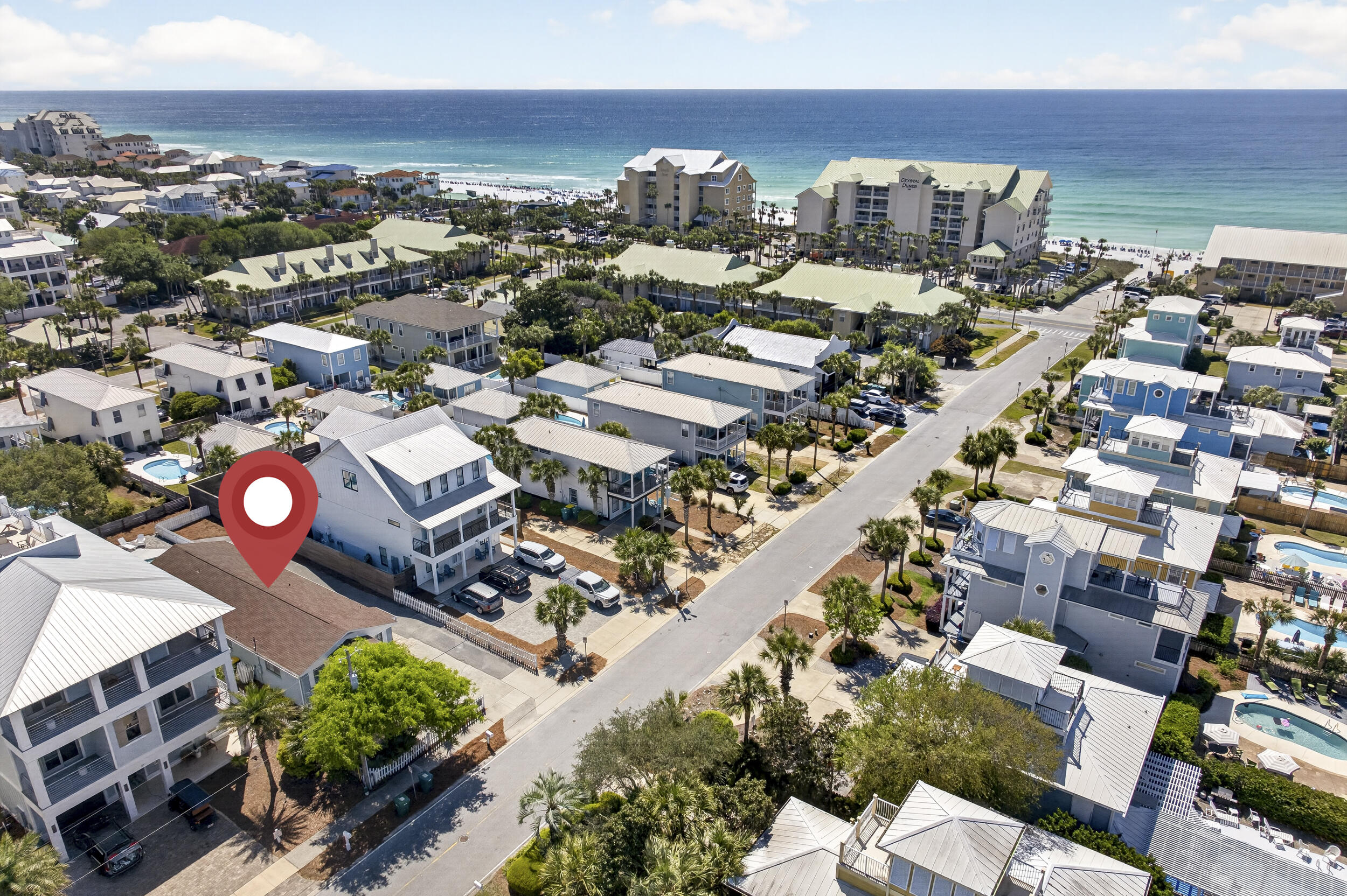 LOWEST priced property in the community that is within 1 block of direct public beach access. Just 500 feet to the Shirah Beach Access & 0.2 miles to the Shores of Crystal Beach Access.  No HOA - 50X150 Lot - Private Pool - Fully Furnished - Short Term Rental with Summer Bookings - Room to Expand. Positioned in a Prime location on one of the favorite streets in Crystal Beach, this 5BR/3.5BA beach cottage has been thoughtfully updated with a modern coastal aesthetic & is being sold fully furnished & rental ready with rental projections up to $112,000! Nestled between multi million dollar homes and within 2 minutes to Destin's famous white sand beaches, this little gem offers so many possibilities - use it as a Turnkey fully furnished vacation rental now while you plan a new build or expansion for the future. Very FEW opportunities like this still exist in the Crystal Beach community -particularly with this proximity to the beach & the potential for future expansive Gulf views with new construction. One of the original cottages in Crystal Beach, this charming beach home has been lovingly cared for, is well maintained & the configuration is perfect for maximizing rental capability. The kitchen has stainless appliances, granite countertops, subway tile backsplash, an undermount sink & a large breakfast bar. There are two living spaces - the main living room as well as a large bedroom/bonus room with bunks & 2nd living area. Flooring in living room/kitchen & bonus room updated with a beautiful wood look plank ceramic tile for easy care. Spacious pool deck already plumbed for natural gas, offering the perfect setup to potentially add an outdoor kitchen and elevate your entertaining space. The property offers tons of parking and plenty of room for outdoor recreation. Enjoy morning coffee by the gorgeous pool, an afternoon dip in the Gulf, head a couple of blocks to Camille's for happy hour & live music then to the beach for sunset! The iconic Crystal Beach neighborhood on Scenic Hwy 98 has it all - quick access to Destin Commons, Publix, Henderson Spa, & Henderson Beach State Park. Crystal Beach is minutes to fabulous restaurants, the Scenic 98 bike path & all that Destin has to offer. Centrally located so quick drive to both Sandestin area attractions and the Harbor District. Full time City of Destin residents are eligible for free City parking passes, Joe's Bayou Boat Launch annual sticker & reduced Henderson Beach State Park annual pass. Flood Zone X so no flood insurance is required.  This property has SO much potential! Make your appointment to see this fabulous piece of paradise today.  Buyer to verify all pertinent information and conduct their due diligence.