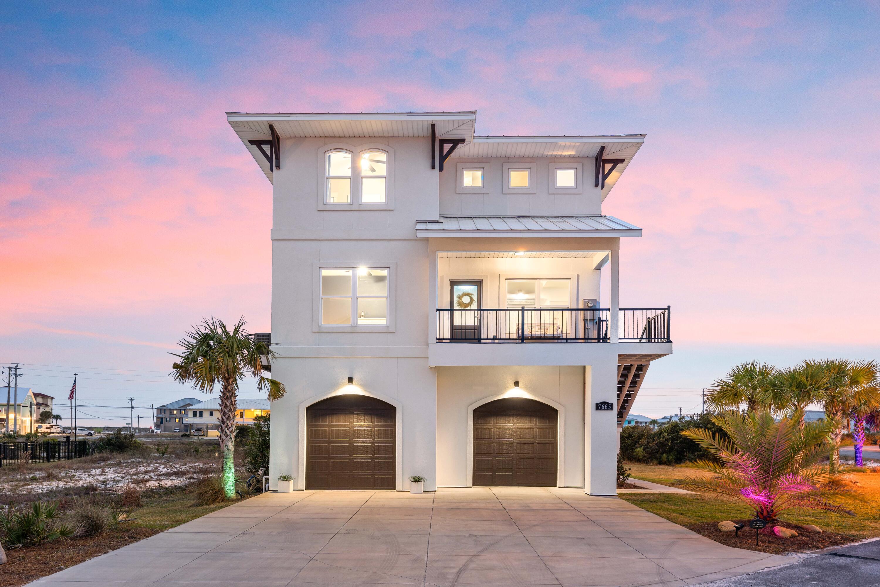 Exceptional 2022 construction coastal retreat where luxury, views, and thoughtful design come together. Built in 2022 and offered fully furnished and turn-key, this stunning home boasts 97 ft of tranquil pond frontage while capturing Pond, Gulf, and Sound views from multiple balconies and throughout the interior. The expansive side yard to the west provides a rare sense of privacy and open space, ensuring no future construction will interrupt your sunsets. Inside, you'll find 9-foot ceilings throughout and a bright, open-concept floor plan designed for both relaxing and entertaining. The spacious living and dining areas are perfectly positioned to take in sweeping Pond, and Gulf views, complemented by a cozy fireplace that adds warmth and charm. The large kitchen features quartz countertops, ample storage space, a large built-out pantry, and seamless flow into the dining area overlooking the water. This home offers 3 bedrooms plus a substantial office with glass French doors and equipped with a Murphy bed, providing flexibility for guests or remote work. The primary suite is a true sanctuary, set along the pond with a 10-foot tray ceiling, private southern facing balcony, and stunning views. Enjoy His & Hers closets and a spa-like bathroom complete with quartz countertops, dual vanities with a glam station, a glass-enclosed shower, and a separate garden tub. Designed with convenience in mind, the property includes an oversized garage with soaring ceilings, no shortage of storage space, and space for 3 vehicles, along with additional driveway parking for 4 cars--ideal for hosting family and guests. Located within the highly coveted gated community of Caribbean Isle, residents enjoy access to premium amenities including a tennis court, community pool, and hot tub. Short-term rentals are allowed, making this an excellent opportunity for both personal enjoyment and investment potential. Whether you're seeking a full-time residence, second home, or income-producing property, 7665 Key West Drive delivers the ultimate blend of coastal luxury, privacy, and panoramic water views.