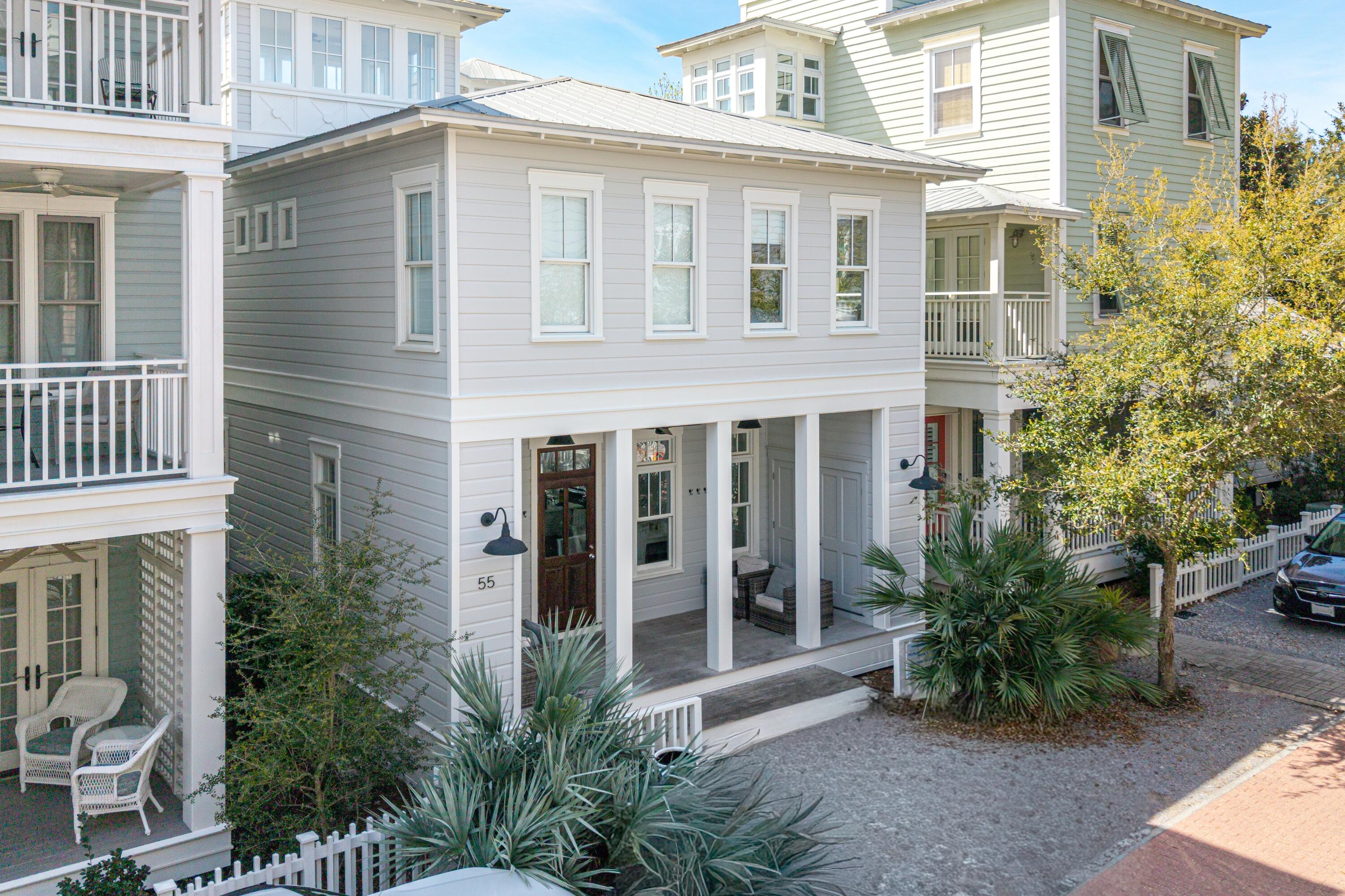 Experience the epitome of coastal living in this exceptionally decorated three bedroom plus sleeping loft cottage, designed for ultimate comfort and style. Featuring gleaming hardwood floors throughout, the open-concept first level offers a cozy fireplace, half bath, and a stunning kitchen. The alluring tiled wall with open shelving is the focal point in the kitchen. A center island offers extra storage and accommodates additional seating for extended family. The white-washed wood dining table seats eight. Induction cooktop and KitchenAid appliances complete the kitchen. Upstairs, enjoy a luxurious master king suite with a spa-like bath and dual vanities, a second king bedroom and a fun bunk room with two sets of bunks share a full hall bath. The third level tower loft provides additional
