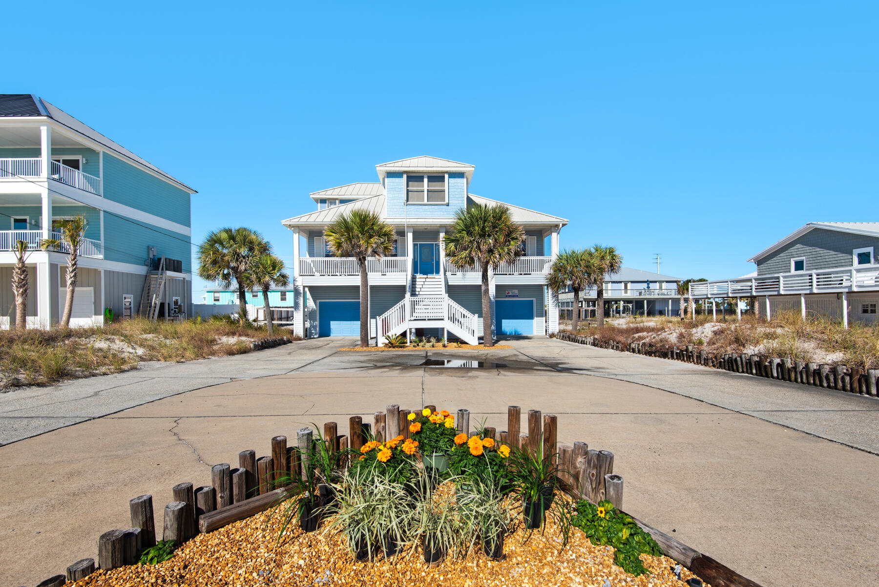Don't let this one get away!! Welcome to your dream Navarre Beach retreat! This stunning 4-bedroom, 3.5-bathroom fully furnished home is perfectly located just steps from the Gulf of Mexico and a short walk to the tranquil Santa Rosa Sound. The spacious open floor plan on the main level is bathed in natural light from expansive windows and features high ceilings that create an inviting atmosphere. The kitchen, equipped with beautiful Corian countertops and upscale stainless steel appliances, flows seamlessly into the living and dining areas, offering an ideal space for entertaining. The large fenced in back yard has plenty of room to add a pool. Enjoy the Gulf Views from the front porch and sound views from the back porch.