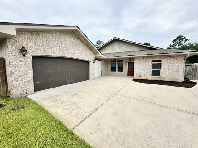 Elegant Craftsman-style, all-brick single-story home in central Fort Walton Beach offering 4 bedrooms and 3 bathrooms. Situated on a cul-de-sac, this residence features a huge kitchen with center island, breakfast bar, walk-in pantry, custom cabinetry, Frigidaire Gallery stainless appliances including a commercial-grade refrigerator/freezer and granite countertops. The master suite includes double-vanity sinks, two walk-in closets with built-ins, a jacuzzi tub, separate shower and a private toilet closet. Interior highlights include crown molding, raised ceilings, elegant chandeliers, tile flooring throughout, ceiling fans, a sunroom and an inside utility room. A breezeway connects the home to a detached 2-car garage with auto opener. Plenty of parking in the front plus there is more behind the fence, that would fit a boat or trailer (as long as it cannot be seen from the street). Outside amenities include a partially covered back patio, privacy-fenced backyard, pool with weekly pool service included and outdoor lighting that enhance the home's Louisiana-influenced character. Property is move in ready and awaiting its next new family! Sorry no pets/smoking allowed. Security deposit is equal to one months rent.