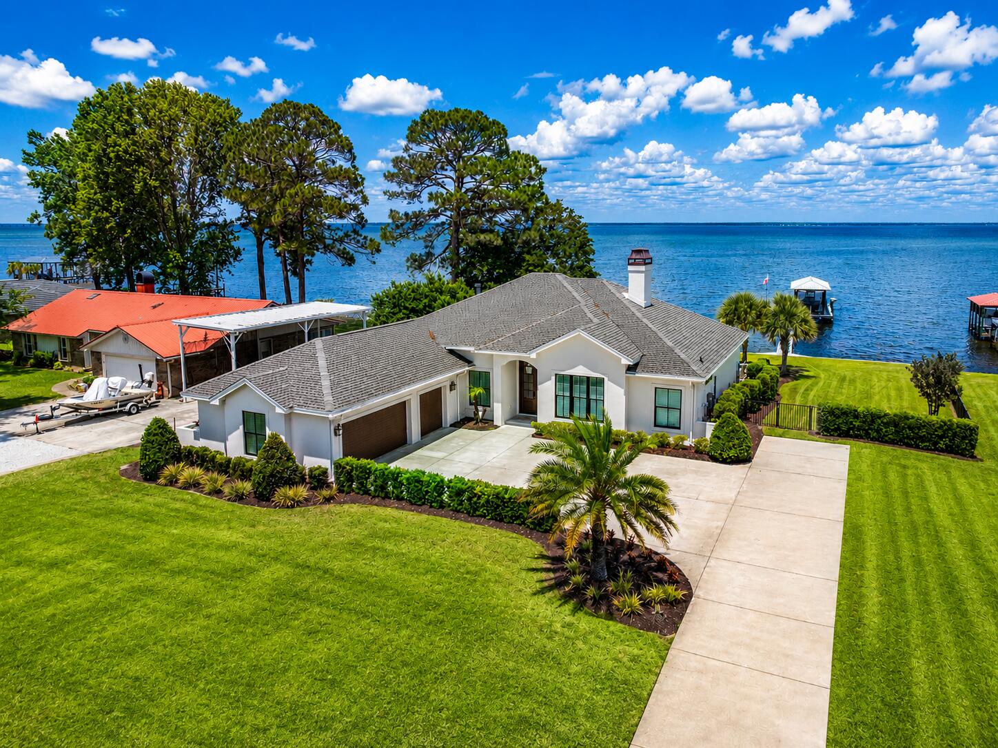 Perfectly positioned along one of the most coveted stretches of bayfront shoreline in Miramar Beach, this exceptional waterfront residence offers a rare combination of luxury, lifestyle, and location. 
Nestled on an expansive .63-acre bayfront homesite with panoramic water views and direct access to Choctawhatchee Bay, 932 Shore Drive represents one of the finest waterfront opportunities currently available along the Emerald Coast.

Recently transformed through a comprehensive interior and exterior renovation, the home blends sophisticated coastal design with effortless waterfront living. Clean architectural lines, designer finishes, custom cabinetry, elevated lighting, and thoughtfully curated spaces create a refined yet welcoming atmosphere throughout. Designed for both relaxed everyday living and elevated entertaining, the residence seamlessly connects indoor and outdoor spaces while maximizing the stunning bayfront setting.

The spacious floor plan also includes a dedicated office and flexible sleeping space, offering additional versatility for guests, remote work, or expanded accommodations--an increasingly valuable feature for today's luxury buyer.

The primary suite serves as a private retreat featuring spa-inspired finishes, including a luxurious steam shower and wellness-focused bath amenities designed to create a true resort experience at home.

Step outside to experience a private waterfront oasis complete with a heated pool and spa, expansive entertaining areas, lush professional landscaping, and a covered outdoor pavilion with summer kitchen. The private dock features a covered boat lift with water and electric, providing immediate access to boating, fishing, paddleboarding, and sunset cruises across the bay and Gulf waters beyond.

What truly separates this property from others is its extraordinary location. Shore Drive is widely regarded as one of the premier bayfront locations in the area, offering a uniquely relaxed coastal lifestyle paired with unmatched convenience. One of the few locations along the Emerald Coast where you can golf cart to the beach, restaurants, shopping, and entertainment within minutes, the property captures the essence of luxury coastal living without sacrificing accessibility.

Additional highlights include a new roof, updated HVAC systems, new tankless water heater, new windows and doors, upgraded systems throughout, and no HOA restrictions--allowing owners the freedom to fully enjoy this remarkable waterfront retreat.

Whether serving as a primary residence, second home, or legacy waterfront estate, this is a rare opportunity to own one of Miramar Beach's most desirable bayfront addresses.