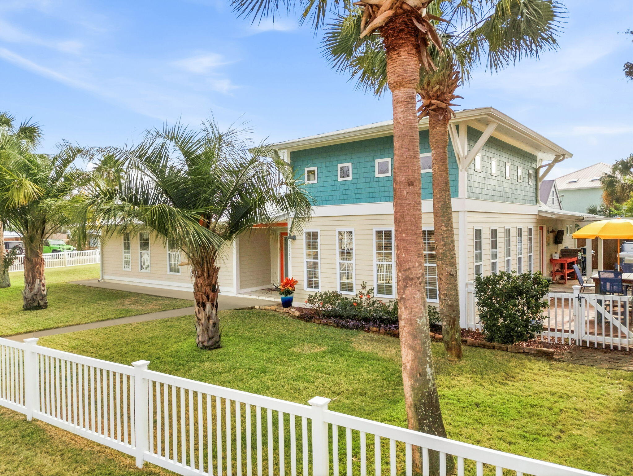 This fabulous double-lot (1/3 acre) resort home with a pool is perfectly situated on South Lagoon in the heart of Panama City Beach's highly desirable east end. Just a short walk to the World's Most Beautiful Beaches and Grand Lagoon, this prime location also offers 2 nearby boat ramps with lagoon access to the Gulf. This inviting, one-of-a-kind custom beach home features soaring 16-foot ceilings in the living room, beautiful LVP flooring, coastal colors, shiplap accents, three spacious bedrooms, stainless steel appliances, and granite countertops. Outdoor living truly shines with multiple entertaining spaces, a pool added in 2021, and a brand-new relaxing hot tub. The possibilities are endless...use as a primary residence, a relaxing personal resort, a high- high-performing vacation rental, or divide the lots and build on the second parcel. Additional features include a standing-seam metal roof, a two-car garage, a separate storage shed, and a private well for the sprinkler system. Located in a golf-cart-friendly neighborhood with no HOA, you'll enjoy easy access to the beach, Grand Lagoon, St. Andrews State Park, boating, dining, and entertainment. Call today to make this exceptional property your primary home, vacation getaway, or investment opportunity!