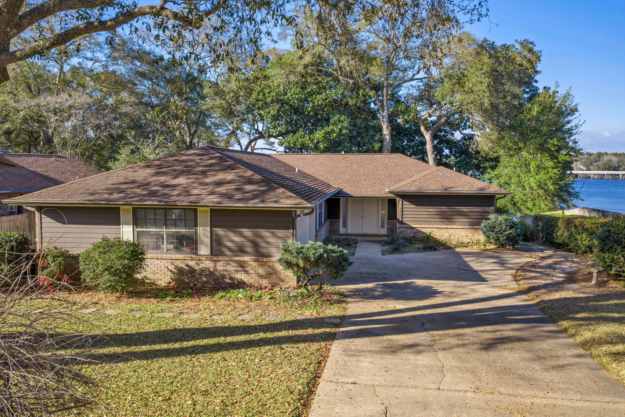 **Rare waterfront opportunity**
Set on a high-and-dry deep-water lot overlooking stunning Rocky Bayou, this unique property offers the perfect blend of natural beauty and boating lifestyle. Enjoy peaceful water views, mature tree-lined streets, underground utilities, and a sought-after neighborhood known for its charm and privacy.

The home sits on a truly gorgeous waterfront setting and is ready for your personal vision and updates -- an ideal chance to create your dream retreat in an exceptional location. Whether you're a boating enthusiast, nature lover, or investor, opportunities like this rarely come along.