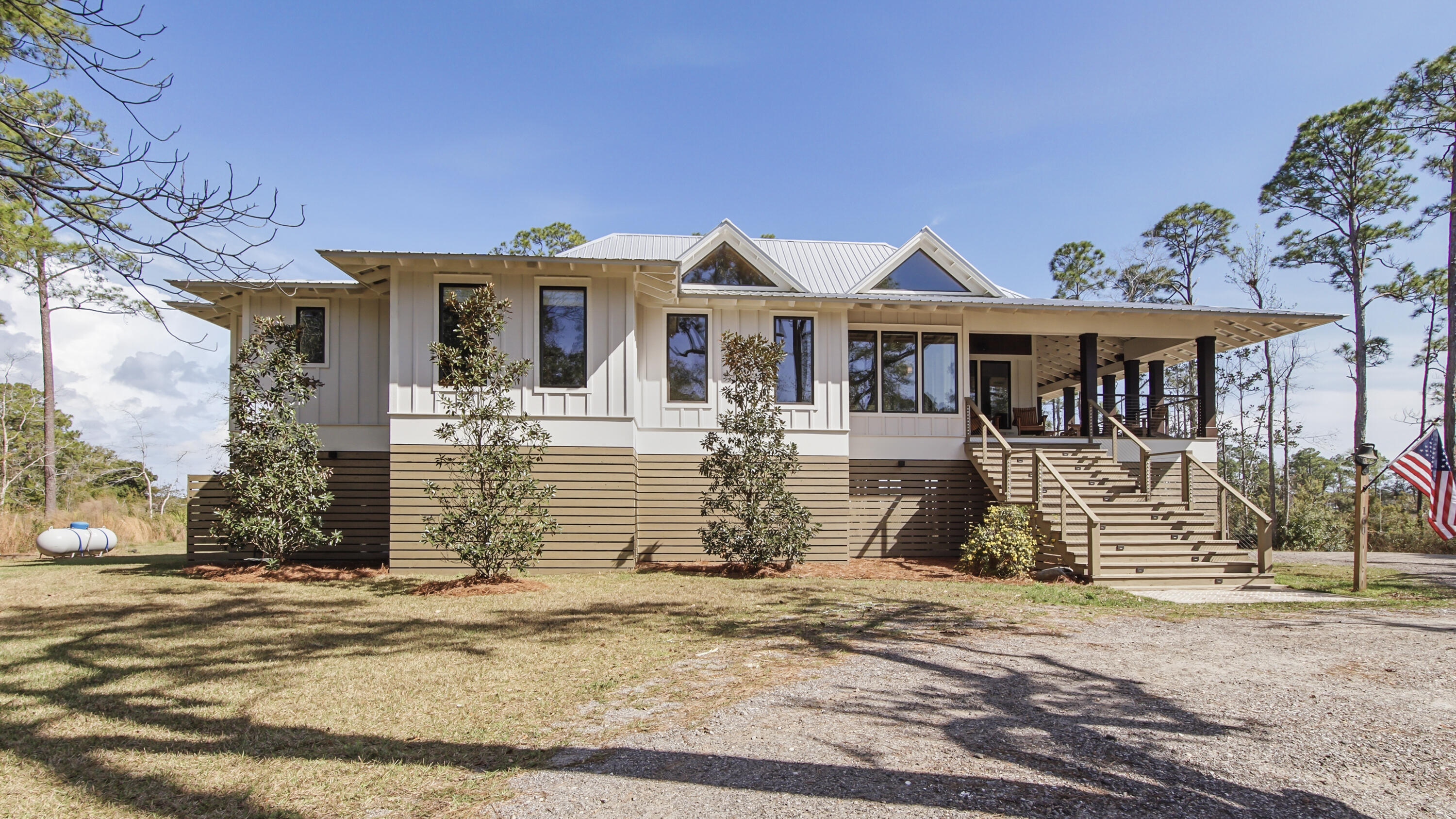 Waterfront Luxury on 3+ Acres with 300 Ft of Bayou Frontage

Welcome to 160 Eventide Lane in Freeport, FL, a breathtaking, Simmons Home Builders custom built waterfront home inspired by Southern Living's New Tideland Haven floor plan. Perfectly situated on over 3.07 private acres with more than 300 feet of frontage on beautiful Lagrange Bayou, this property offers sweeping panoramic water views and the ultimate coastal lifestyle.

This thoughtfully designed home features 2,622 square feet of heated and cooled living space, showcasing 3 bedrooms, 4 full bathrooms, plus an additional office/study or flex room that can easily serve as a home office, guest room, or hobby space. The open-concept design is highlighted by vaulted ceilings, exposed wood beams, and walls of windows that flood the home with natural light while capturing stunning bayou views. A striking driftwood gas fireplace anchors the living room, while a built-in surround sound music system enhances the home's entertainment experience.

The chef's kitchen is beautifully appointed with modern appliances, a gas range, custom pecky cypress hood vent, gold/brass fixtures, and an enormous walk-in pantry, offering both style and functionality. Just off the kitchen is a formal dining room, perfect for hosting gatherings and special occasions. Sliding glass doors lead to expansive wraparound porches, seamlessly blending indoor and outdoor living while showcasing the tranquil waterfront setting.

The spacious primary suite serves as a relaxing retreat and features a private balcony overlooking the bayou, providing the perfect spot to enjoy morning coffee or evening sunsets. The luxurious primary bath includes a freestanding soaking tub, separate tiled shower, and an oversized walk-in closet. Throughout the home you'll find cypress tongue-and-groove ceilings, beautifully tiled showers, custom finishes, large guest bedrooms with walk-in closets, and abundant storage space.

On the ground level, the property offers a one-car garage with an additional 800-square-foot insulated, heated, and cooled space that is not included in the home's 2,622 heated/cooled square footage. This versatile area includes an outdoor shower, commercial-style restaurant sink, and covered space ideal for outdoor grilling, lounging, relaxing, and entertaining, making it perfect for hosting friends and family after a day on the water.

Enjoy true waterfront living with a 300-foot private dock leading to your very own covered boat lift and sundeck, providing easy access to boating, fishing, paddle-boarding, and breathtaking sunsets across Lagrange Bayou to the Choctawhatchee Bay.

Located in the desirable NO HOA, Cross Creek Shores subdivision just off Bay Loop Road (with over 15 miles of adjacent paved walking or biking path), this rare waterfront estate offers privacy and space while remaining just minutes from the beaches of South Walton, Hammock Bay General Store, Freeport Regional Sports Complex, Props Brewery, public boat launches, a brand new Marina with boat storage, more dining, and shopping.

So if you've been searching for a luxury custom waterfront home with acreage, superior craftmanship, breathtaking views, and direct bayou and bay access, this one-of-a-kind property is a must see; never miss a sunrise or sunset on the water again.