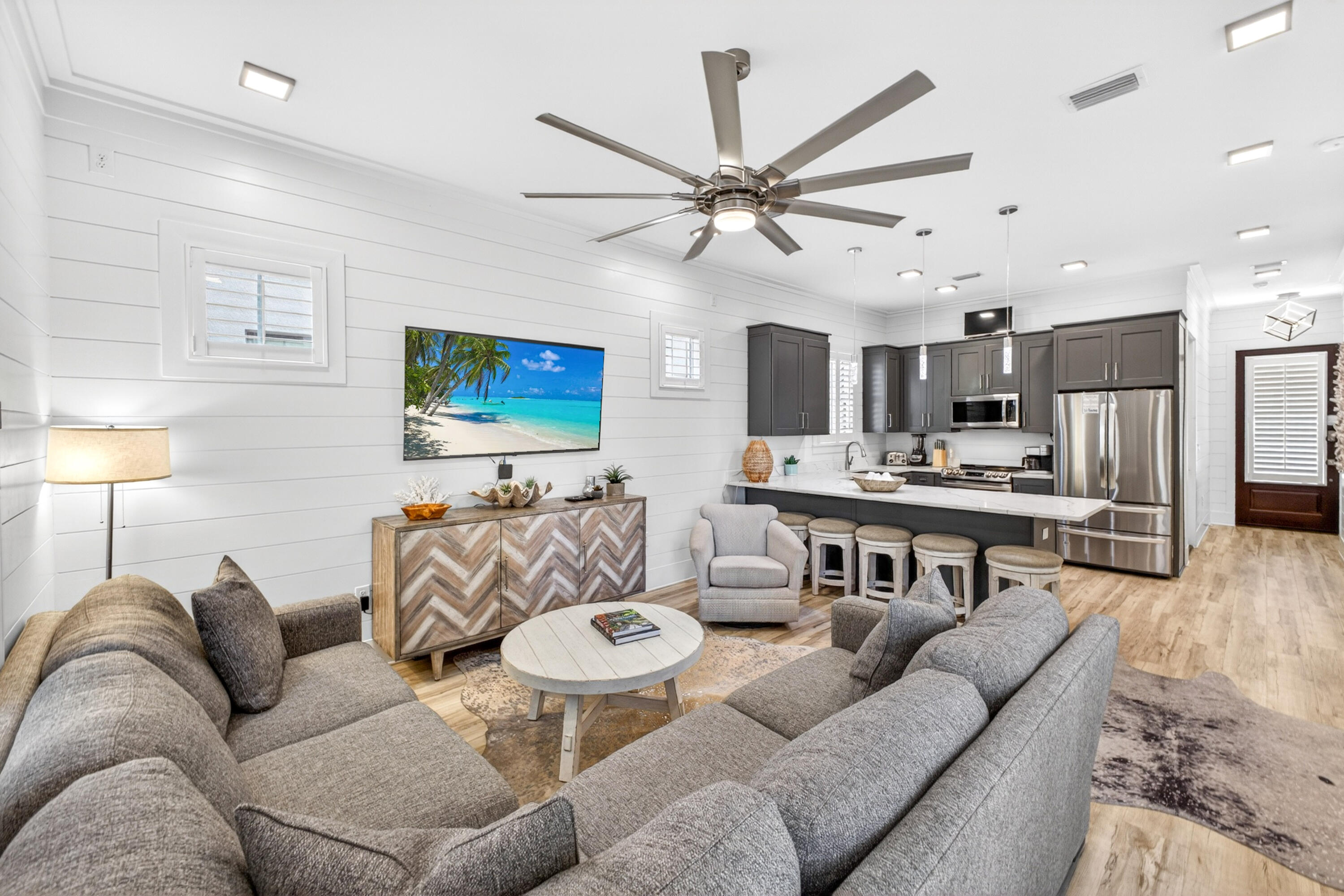 Experience refined resort living in this beautifully appointed 2021 built two-story home in the sought-after Villa Lago community of SANDESTIN GOLF AND BEACH RESORT®. Offering 4 bedrooms, 4 bathrooms, and two included golf carts, this residence is perfectly designed for comfortable family living, entertaining, and enjoying the resort lifestyle.
Inside, white wood-paneled walls, natural wood flooring, and an open-concept layout create a bright and inviting coastal atmosphere. The spacious kitchen features stainless steel appliances, a large breakfast bar, and seamless flow into the main living area and private power screened patio complete with a propane grill and outdoor TV. A first-floor guest suite with en suite bath provides added convenience and privacy.
Upstairs, a secondary living area offers additional space to relax, along with a luxurious primary suite featuring a custom tiled walk-in shower and double vanity. Two additional guest bedrooms and bathrooms provide ample accommodations for family and visitors. Additional highlights include the installed Remy Halo® whole-home air purification system, designed to reduce airborne contaminants and enhance indoor air quality.
Enjoy exclusive access to a private neighborhood pool, two additional resort-style pools, and the vibrant Baytowne Wharf, known for its charming boutiques, lively entertainment, and numerous dining options. Beyond the community, you are just moments from the upscale allure of Grand Boulevard and the world-famous white-sand beaches of Florida's Emerald Coast.
As an introduction to the Sandestin lifestyle, we invite our new owners to explore amenities that make Sandestin special. The listing brokerage and seller(s) are presenting the buyer(s) of this property with (2) 90-minute rounds of Tennis court time, a golf foursome at one of our three championship courses, and a round of golf for up to four (4) players at the unrivaled Burnt Pine Golf Club.
Sandestin Golf and Beach Resort features more than seven miles of beaches and pristine bay front, four championship golf courses, 15 world-class tennis courts, a 226-slip marina, a fitness center, spa and celebrity chef dining. Shop, dine and play at the charming pedestrian village, The Village of Baytowne Wharf and more. Inside the gates of the resort, residents enjoy a balanced lifestyle of high-class living, spanning the 2,400 acres from the beach to the bay. Everything within the gates of the resort is accessible by golf cart or bicycle. The entire resort is interconnected by miles of pedestrian, bike and golf cart paths that weave through groves of live oaks, meandering past natural lagoons, fountains, man-made lakes, and meticulously landscaped fairways.