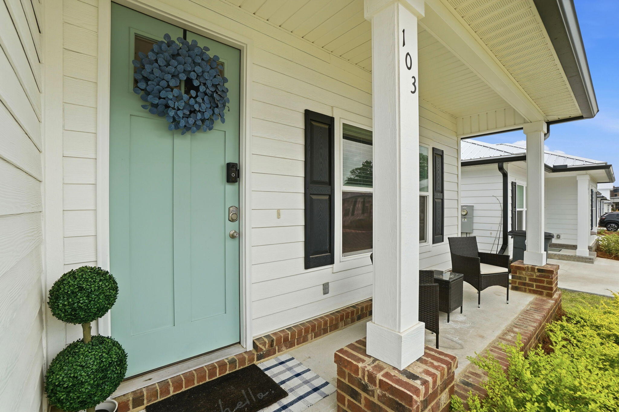 Affordability meets coastal charm at 103 Penny Lane.
Low-maintenance living with exceptionally low monthly costs--this is the kind of home that just makes sense. Walk in to high ceilings and modern 2 panel doors that give off a grand vibe! Enjoy breakfast at your new eat-in kitchen bar and relax by the firepit in the evening. 
Granite, shaker style cabinets, laminate vinyl plank flooring throughout AND a durable metal roof ensure that you will not be spending your weekends on projects or lawn maintenance.