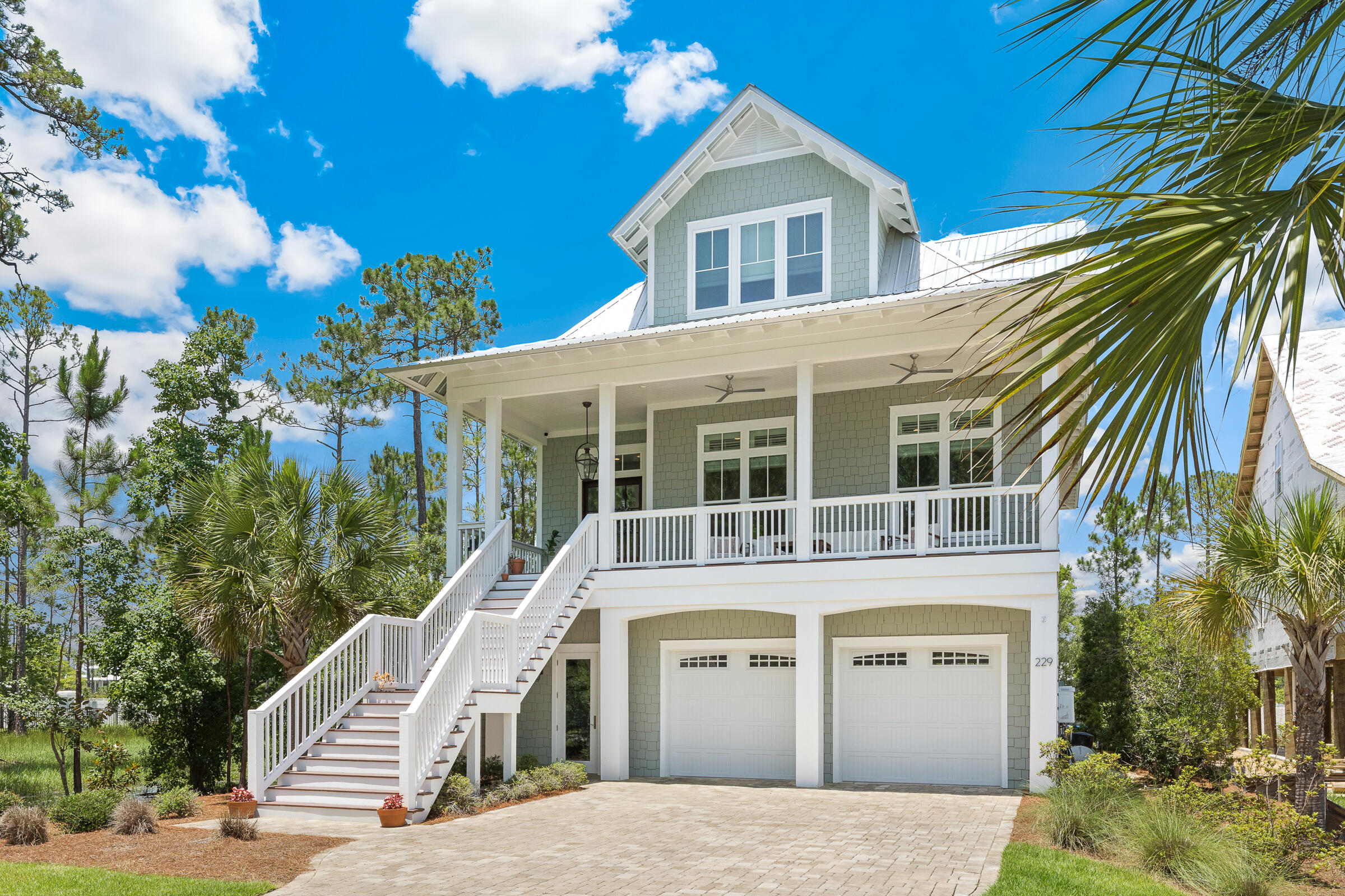 This gorgeous custom designed/built home in the small, gated, waterfront community of Cessna Landing is available for new ownership.
This stunner features four bedrooms, and three and a half baths. The first/ground level garage has room for four vehicles, plus plenty of storage.  Entry foyer off the garage offers ''sand'' room collection area for shoes, boots, jackets, etc.  Custom features include 12 ft. ceilings on the second/main living level, 10 ft. ceilings on the third level, and crown molding and white-oak hardwood floors throughout. Bathrooms each have tiled floors and showers with rimless glass doors, while the master bath also has a free-standing soaking tub. Numerous and oversized windows flood the house with natural light. Eight-foot mahogany doors, custom cabinets, high-end appliances, a gas fireplace, and surround sound in the living area and master bedroom all highlight the overall charm and quality of this home. Three stacked closets could be converted back to the original design for an elevator. Several porches and decks- both open and screened offer additional outdoor living spaces. If ever a home was designed for entertaining, it is this one! 
Additional highlights include access to the community pool and the bay, as well as stunning bay views and sunsets. And launching your boat is easy with Cessna Landing boat ramp just across the bridge.