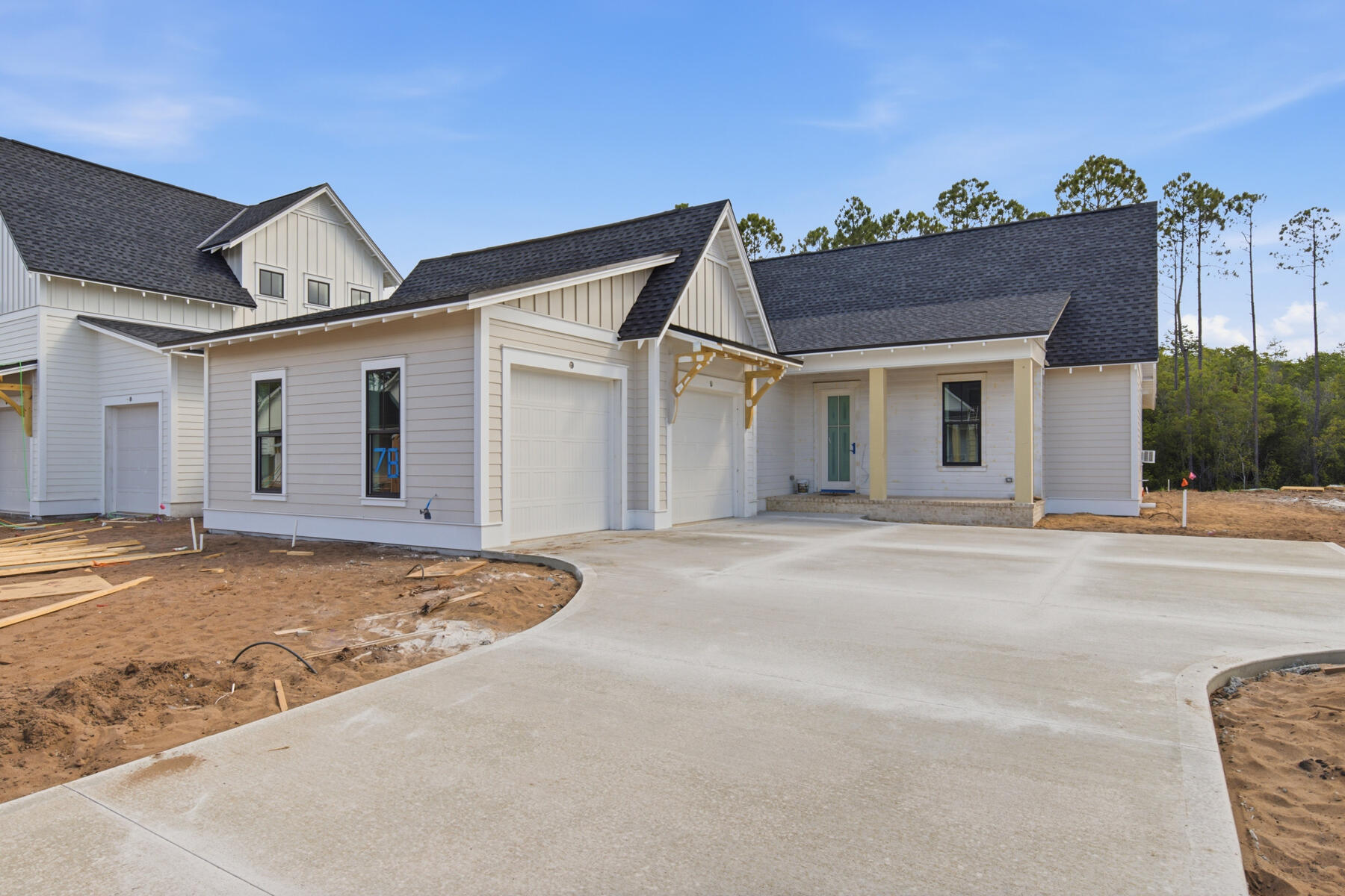 Welcome to the Sydney plan, part of the Preserve Collection in the Arborview Park neighborhood of Watersound Origins. Positioned on a deep homesite exceeding 150 feet with a wooded view, this thoughtfully designed single-level home offers 4 bedrooms, 3 bathrooms, and a 2-car garage and private pool and spa.

The open living, dining, and kitchen areas create a spacious central gathering space, highlighted by 16-foot sliding glass doors in the living room that open to a 12' x 24' screened rear porch with a gas fireplace, seamlessly connecting indoor and outdoor living.

The kitchen is designed for both function and style with quartz countertops, upgraded stainless steel Wolf appliance package, a expanded island with extra cabinets, and stacked glass upper cabinets that add visual interest and additional storage.

The primary suite is privately positioned and features a well-appointed bath with a freestanding soaking tub, tiled shower, dual vanities, and a large walk-in closet. Each of the guest bedrooms includes generous walk-in closets, offering excellent storage throughout the home.

Additional upgrades include pre-wiring and a gas stub for a future generator, plumbing for a water filtration system, shiplap in the foyer, along hallway leading to garage and on kitchen island, solid core doors throughout, extra cabinets and basin sink in the laundry room, epoxy garage floor and EV car charger.

Homes in the Preserve Collection benefit from larger homesites that provide additional privacy and flexibility for outdoor living, including the opportunity to add a pool.

Estimated completion: end-July 2026

As part of Watersound Origins, often called "A Coastal Village," residents relish abundant amenities like the Village Commons resort-style pool, fitness center, sports courts, miles of nature trails, event lawns, and the Origins Golf Course. Surrounded by towering pines and just minutes from Lake Powell and the beaches of Scenic Highway 30A, this community blends natural beauty with easy access to Inlet Beach, Grayton Beach, and beyond. Upcoming highlights include the 15.5-acre Longleaf Art Park, opening in 2027, featuring cultural and recreational experiences.
