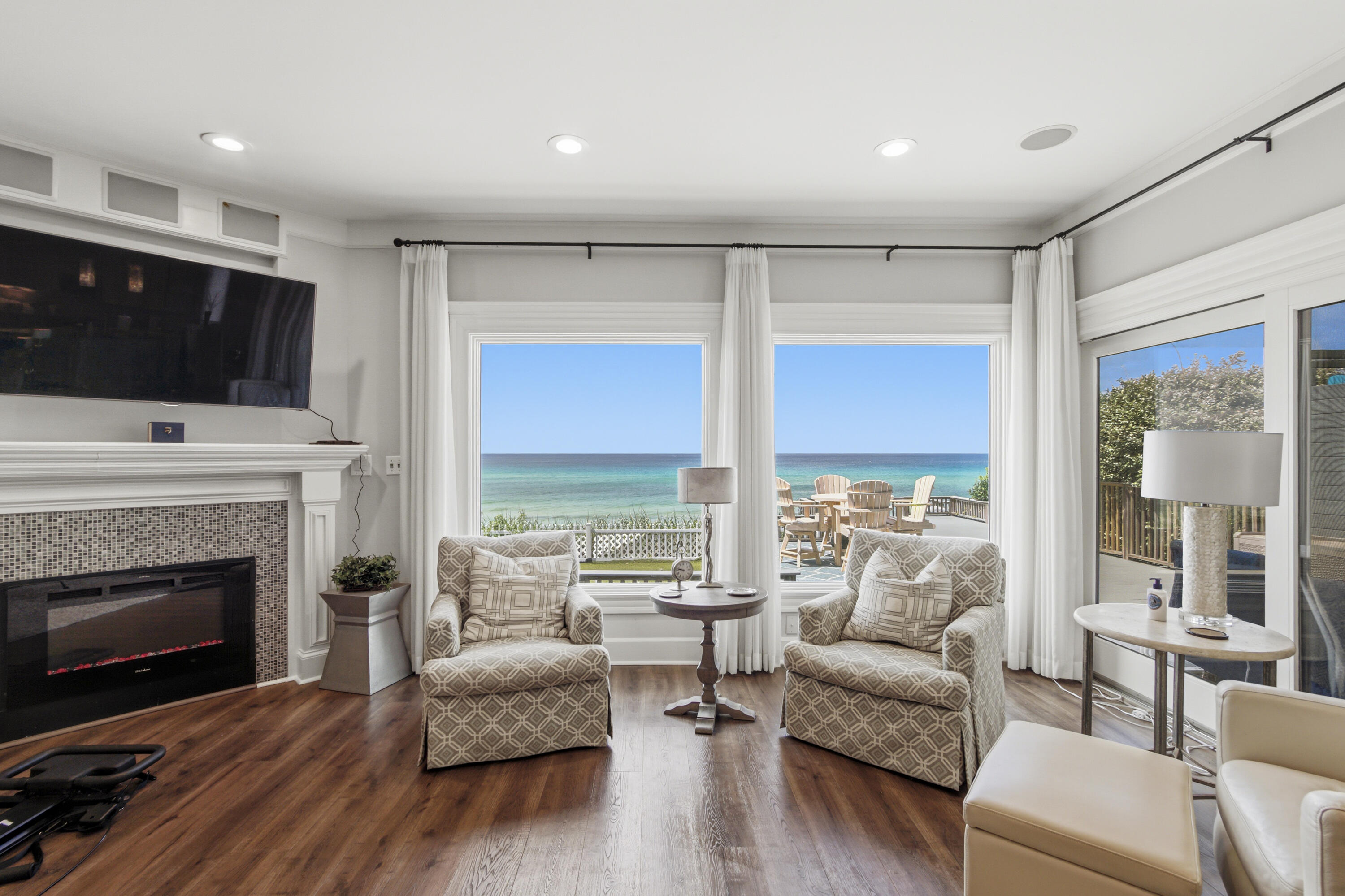 ~~~STUNNING GULF FRONT BEAUTY~~~One of the most exquisite Gulf Front paradises on Scenic Highway 30A. In the gated, non-rental Beach community of Sand Cliffs, your beach and emerald waters of the gulf are waiting for you right out of your back door. You feel like you are the only person enjoying these breathtaking views made just for you!! From the walk down the unique designed pavers to your majestic front door, you walk into heaven. Warm walnut colored wood flooring and muted tones greet you as you walk up to the main living area. Huge windows along the entire front of the home provide the most unbelievable views from atop this high bluff. The main living area is extremely spacious with a fireplace for those cool winter evenings. Exquisite molding throughout the home on ceilings and doors. Dining area is also Gulf