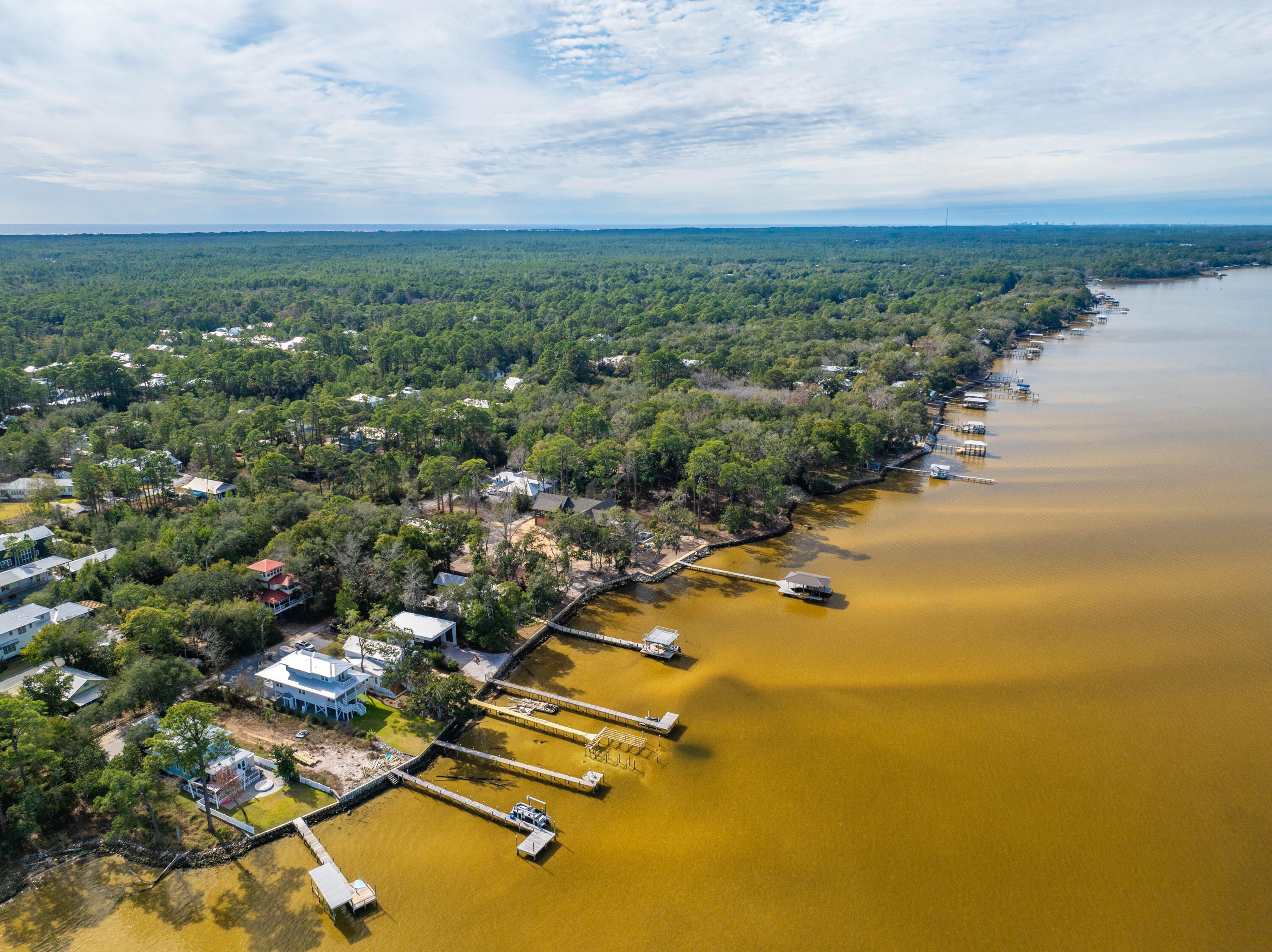 Build your coastal dream on this 0.304± acre homesite in Santa Rosa Beach, ideally situated in the established Choctawhatchee Beach community. With 50 feet of frontage and generous depth of approximately 260 feet, this rectangular parcel offers a private, wooded setting with plenty of room for a custom residence. Tucked just north of Scenic Highway 30A, the property offers convenient access to the Choctawhatchee Bay, Point Washington State Forest, world-class white sand beaches, and the dining and shopping of 30A. A rare opportunity to secure a buildable lot on Florida's sought-after Emerald Coast. Parcel ID 27-2S-19-24030-00F-0090. Buyer to verify all lot dimensions, utilities, zoning, and intended use with Walton County.