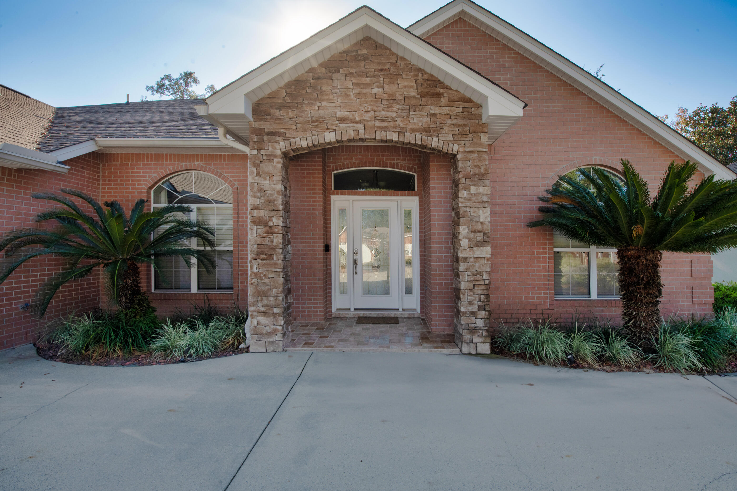 Welcome to 1730 Wren Way--where comfort, space, and location come together in one of Niceville's most desirable, low traffic neighborhoods. This beautifully maintained home offers oversized bedrooms that provide exceptional comfort and flexibility, whether for family, guests, or a dedicated home office.  Enjoy Florida living at its best on the spacious screened in back porch, perfect for morning coffee, evening relaxation, or entertaining. The home features a private backyard with no homes directly behind, giving you rare peace and privacy in a highly sought after area. A rare find in this community, the property includes a three car garage, offering ample room for vehicles, storage, tools, or recreational gear. Located just minutes on foot from popular L.J. Schooners, you'll have easy access to waterfront dining, live music, and the marina lifestyle. As part of the Bluewater community, residents also enjoy access to a community pool, dry storage, boat launch, tennis and pickleball courts, (club fees apply to all) making recreation and convenience part of everyday living. A spacious, quiet, and perfectly placed home--1730 Wren Way delivers the best of Niceville living.