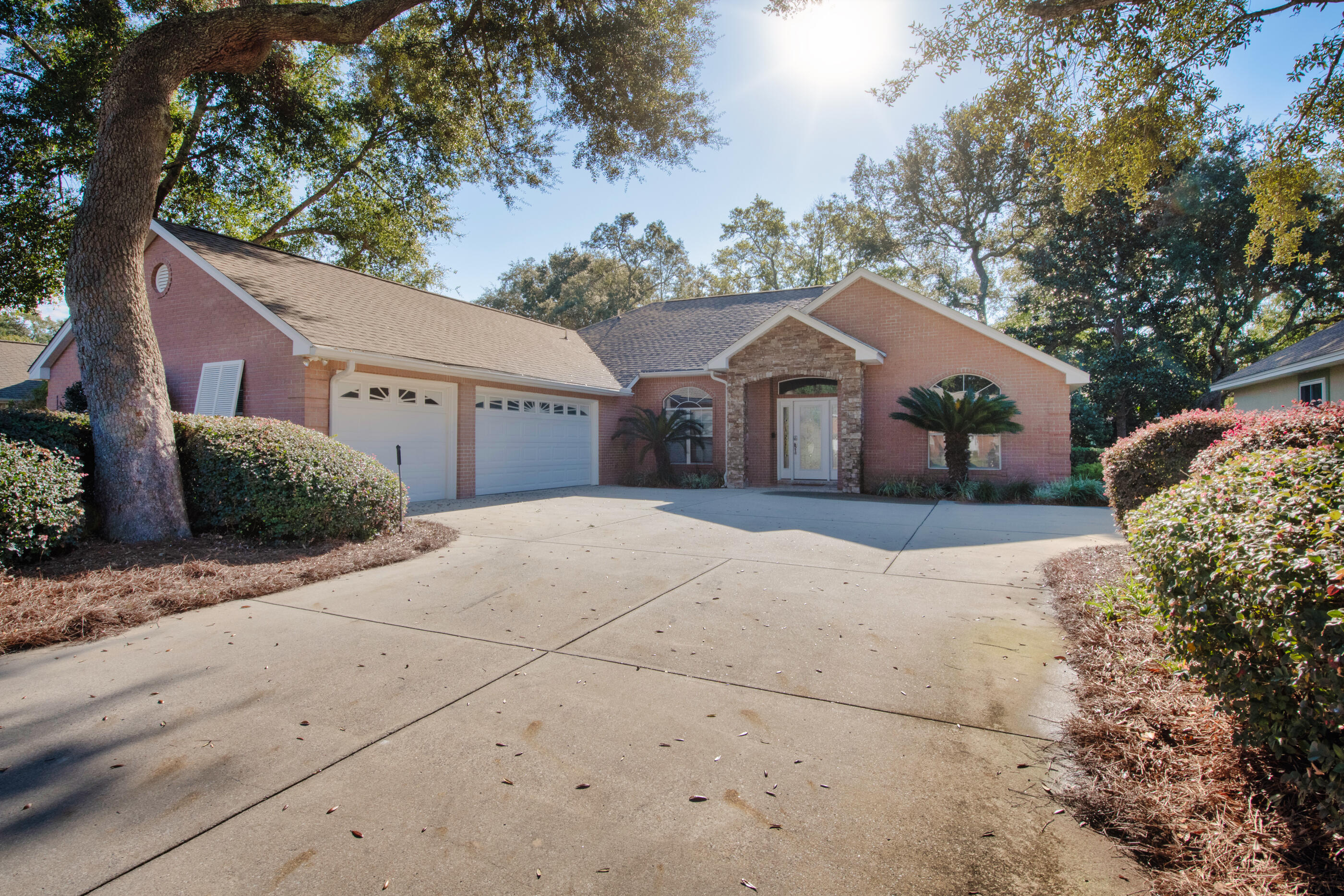 Welcome to 1730 Wren Way--where comfort, space, and location come together in one of Niceville's most desirable, low traffic neighborhoods. This beautifully maintained home offers oversized bedrooms that provide exceptional comfort and flexibility, whether for family, guests, or a dedicated home office.  Enjoy Florida living at its best on the spacious screened in back porch, perfect for morning coffee, evening relaxation, or entertaining. The home features a private backyard with no homes directly behind, giving you rare peace and privacy in a highly sought after area. A rare find in this community, the property includes a three car garage, offering ample room for vehicles, storage, tools, or recreational gear. Located just minutes on foot from popular L.J. Schooners, you'll have easy access to waterfront dining, live music, and the marina lifestyle. As part of the Bluewater community, residents also enjoy access to a community pool, dry storage, boat launch, tennis and pickleball courts, (club fees apply to all) making recreation and convenience part of everyday living. A spacious, quiet, and perfectly placed home--1730 Wren Way delivers the best of Niceville living.