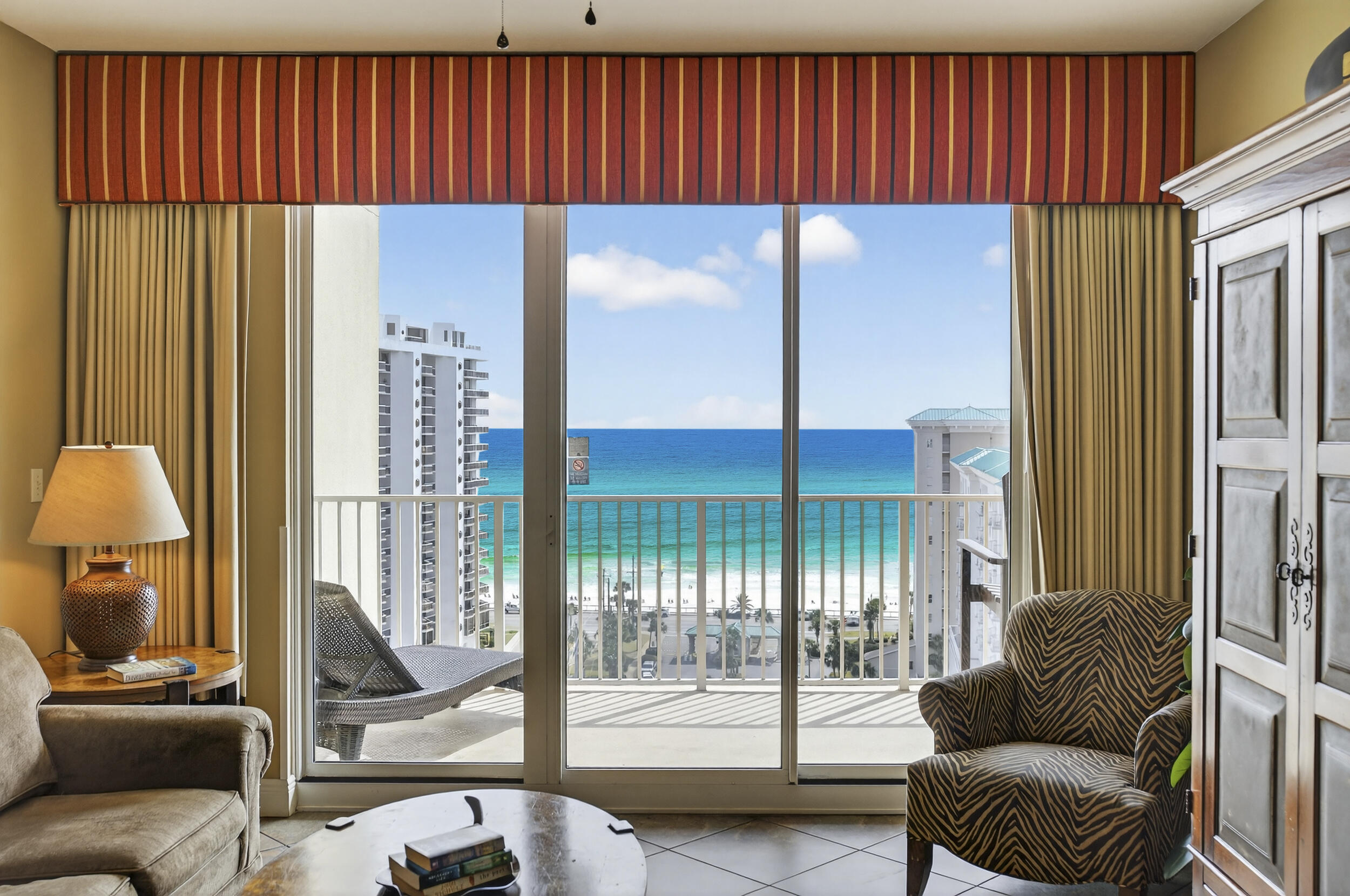 Seller very motivated - bring an offer!           BEST LOCATION in Ariel Dunes Resort with incredible Gulf views and just steps to the beach, 2-bedroom, 2-bath condo offering an open floor plan.  Sold fully furnished, making it an ideal investment property, vacation rental, or second home. The living area and primary bedroom both provide direct access to the oversized balcony, perfect for enjoying the stunning Emerald Coast sunsets. This condo also features a spacious laundry room for added convenience. Recent updates include HVAC (2022), washer and dryer (2023), and stove (2025).  Ariel Dunes is one of the most recognizable resorts on the Emerald Coast within the gated Seascape Resort. Owners and guests enjoy access to over 2,000 feet of deeded white sand beach, resort-style pool, fitness center, onsite dining, tennis courts, and the Seascape 9-hole golf course. Conveniently located near Seascape Towne Centre, offering restaurants, entertainment, and shopping, and just minutes from Silver Sands Premium Outlets and other popular Destin attractions. Whether you're looking for a beach getaway or a high-demand rental property, this unit offers the best resort-style coastal living.