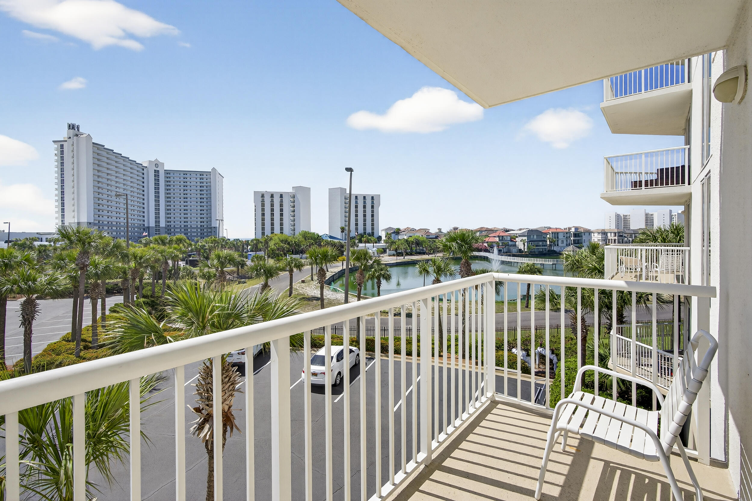 Let it be SUNSHINE - PRICED TO SELL! This beautifully maintained 3-bedroom, 3-bath condo is conveniently located on the second floor--no waiting for elevators. The highly desirable floor plan features wraparound balconies and additional windows, filling the space with natural light. The third bedroom offers its own private ensuite with a mini kitchen--perfect for guests or rental flexibility. Two bedrooms and the living room provide direct access to the spacious balcony, ideal for enjoying the coastal breeze. Recent updates include flooring, drapes, and a renovated primary bathroom shower, all completed just two years ago. The Terrace is located in one of the most popular vacation complexes on the Emerald Coast. Terrace at Pelican has their own pool and grill area, and owners and guests at Terrace have unlimited use to all of Pelican Beach amenities including direct beach access, multiple beachfront pools (including indoor/outdoor options), hot tubs, indoor sauna & steam room, a fitness center, tennis courts, pickleball, on-site café and tiki bar, game room and security gate This condo makes it a great investment, second home or primary residence being in the heart of Destin
