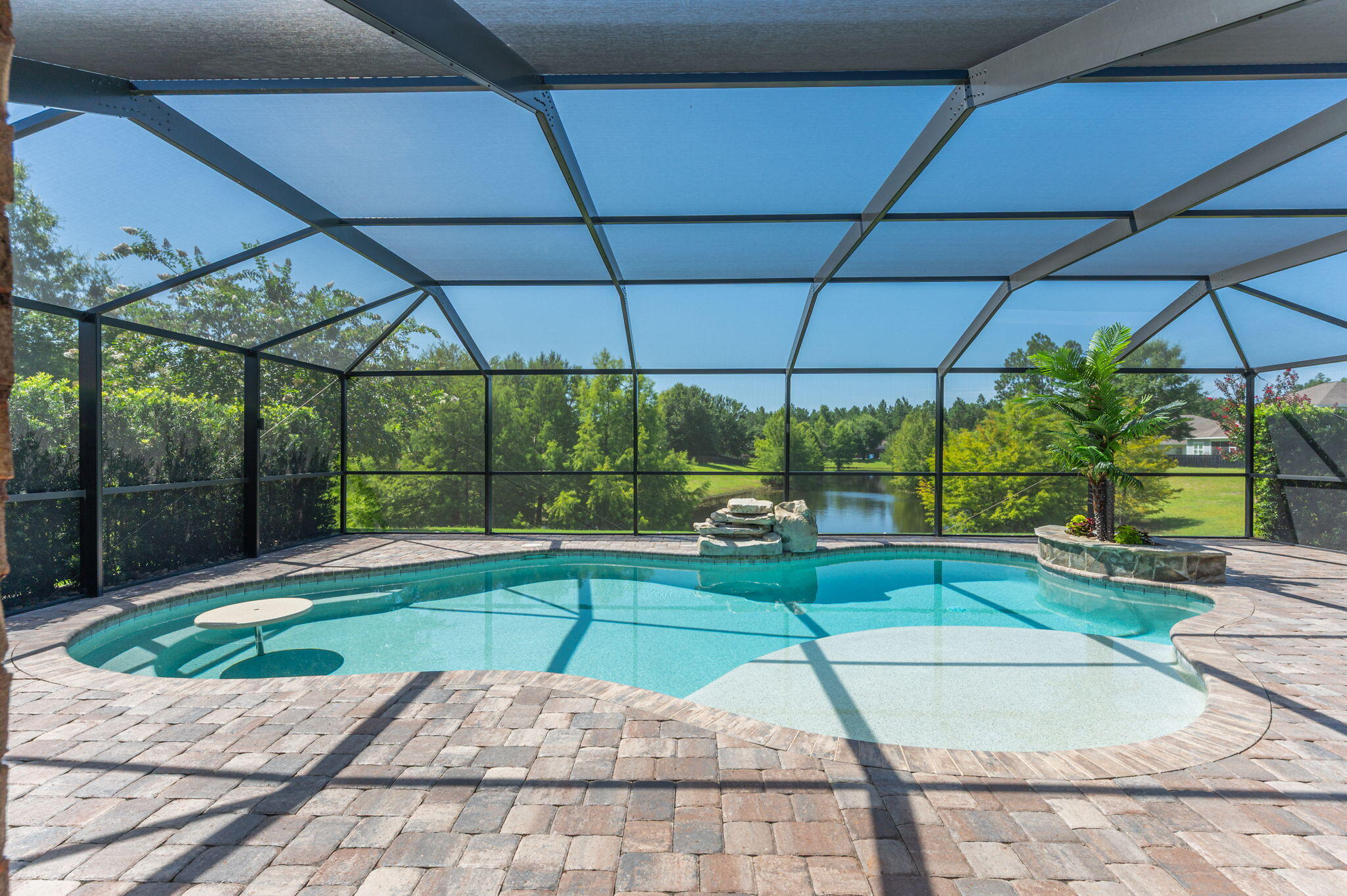 Welcome to your Hammock Bay Dream Home! Do not wait to claim this IMMACULATE, BEAUTIFULLY UPGRADED, POOL HOME with expansive pond views for your own! Tucked away on a spacious and perfectly manicured lot in Symphony at Hammock Bay, discover this absolute gem featuring more than $250,000 in high-end improvements. The flexible, open-concept layout lives much larger than 1851 square feet by wasting no space, while the finely curated updates elevate each room, enhancing beauty and utility. This exquisite property offers a uniquely peaceful, private, and serene retreat in Freeport's premier master planned community at an approachable price point.  Hammock Bay's ever-growing list of premium amenities include several community pools, multiple fitness centers, The General Store, Props Brewery, The Bay Club along Choctawhatchee Bay, The Lake Club, miles of recreational trails, Canine Commons dog park, tennis and pickleball courts, basketball courts, and more. Freeport is Florida's fastest growing city with a vibrant community located within an easy commute to military bases and other employment centers. Jump on the toll-free 331 bridge and enjoy the wonders of South Walton County in minutes - white sand beaches and quaint coastal villages of 30A, endless shopping and dining opportunities, as well as food, wine, music and art festivals year round. 182 Amadeus Avenue simply must be seen to be fully appreciated, so book today! For a detailed list of improvements, costs, & year completed: Custom Closet Organization 2017 $2,676.00
Kitchen Upgrade 2018 $7,631.12
Lighting Upgrades 2019 $4,008.83
Bosch Dishwaser 2020 $1,347.13
Samsung Customized Refrigerator 2023 $3,710.54
Upgraded Blinds 2021 $2,986.54
Living Room Hurricane Slider 2021 $25,945.23
Master Bedroom Slider 2024 $6,950.00
Interior Painting Labor and Supplies 2021 $9,153.57
Master and Guest Bath Upgrades 2021 $23,742.49
Kwikset Front Door WiFi Deadbolt 2022 $101.08
Sensi WiFi Thermostat 2022 $80.00
Blue Haven Pool 2023 $84,247.02
Pool Lanai Cage 2023 $20,800.00
Pool Lighting 2023 $3,290.73
Paver Sidewalk Driveway to Pool 2023 $4,640.00
Driveway Widening Expansion 2023 $3,000.00
Front and Back Porch Polyurea/Polyaspartic Coatings 2023 $2,000.00
Master Bedroom Flooring Upgrade 2024 $2,500.00
Living Room Floor Decorative LVP Inset 2023 $3,000.00
Upgraded Landscaping, Sod, Trees, and Plants 2023 $42,270.00
APEC Reverse Osmosis Water System and Labor 2022 $400.00
Garage Organization Storage Cabinets 2018 $1,497.99
Total $255,978.27