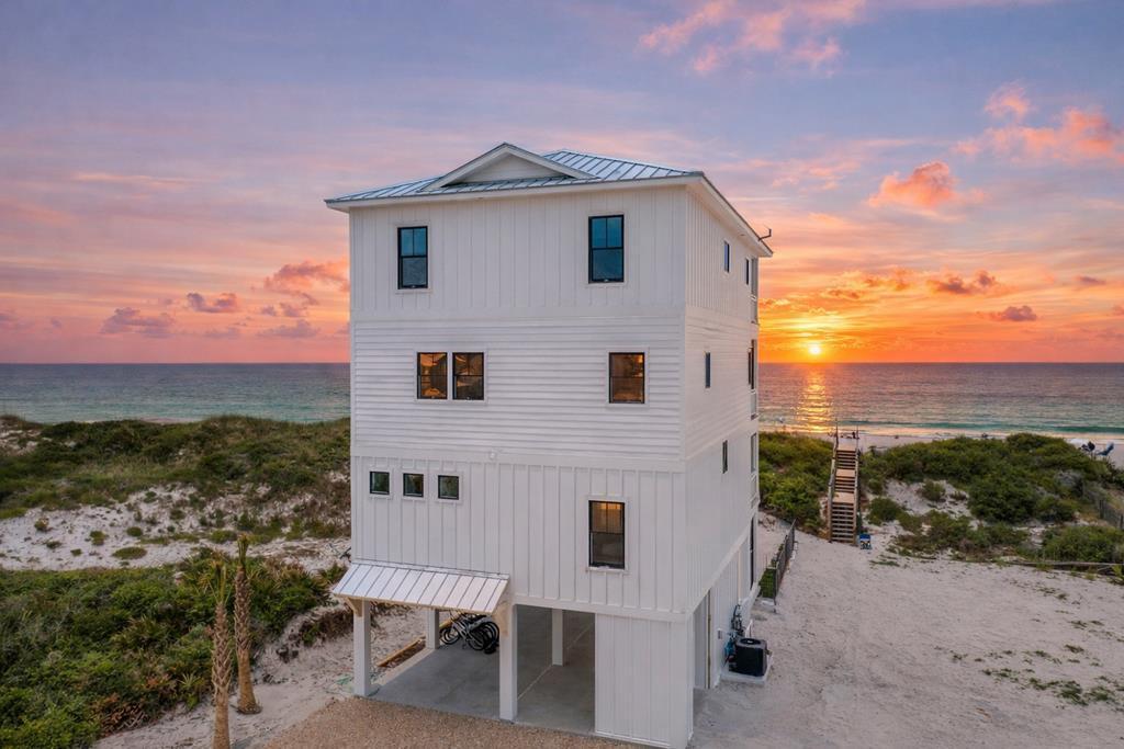 Swirly Sunsets on North Cape San Blas checks every box for an exceptional beachfront retreat. This 7-bedroom home was designed for large groups to enjoy outstanding comfort, luxury, and amenities, all overlooking the Gulf. Guests will love the heated and chilled beachside pool, hot tub, firepit, arcade room, elevator, game deck, and more in this well-built and thoughtfully designed property. Located in an area with an expansive beach and a large protective dune, this home offers both beauty and peace of mind. Personally built and owned by a local builder and Realtor, every detail of the construction and design was carefully planned to maximize space, enjoyment, durability, and rental performance. Completed in summer 2023, the home has been a proven income producer from the start, generating $280,000 in gross rental income in 2024 and $277,000 in 2025. Every finish, furnishing, and feature was selected to provide a luxurious guest experience while standing up to the demands of a high-performing vacation rental. This property is being sold fully furnished, decorated, and equipped as shown. Both listing agents are owners and will consider owner financing for up to 5 years with at least 20% down, minimum 7% rate.