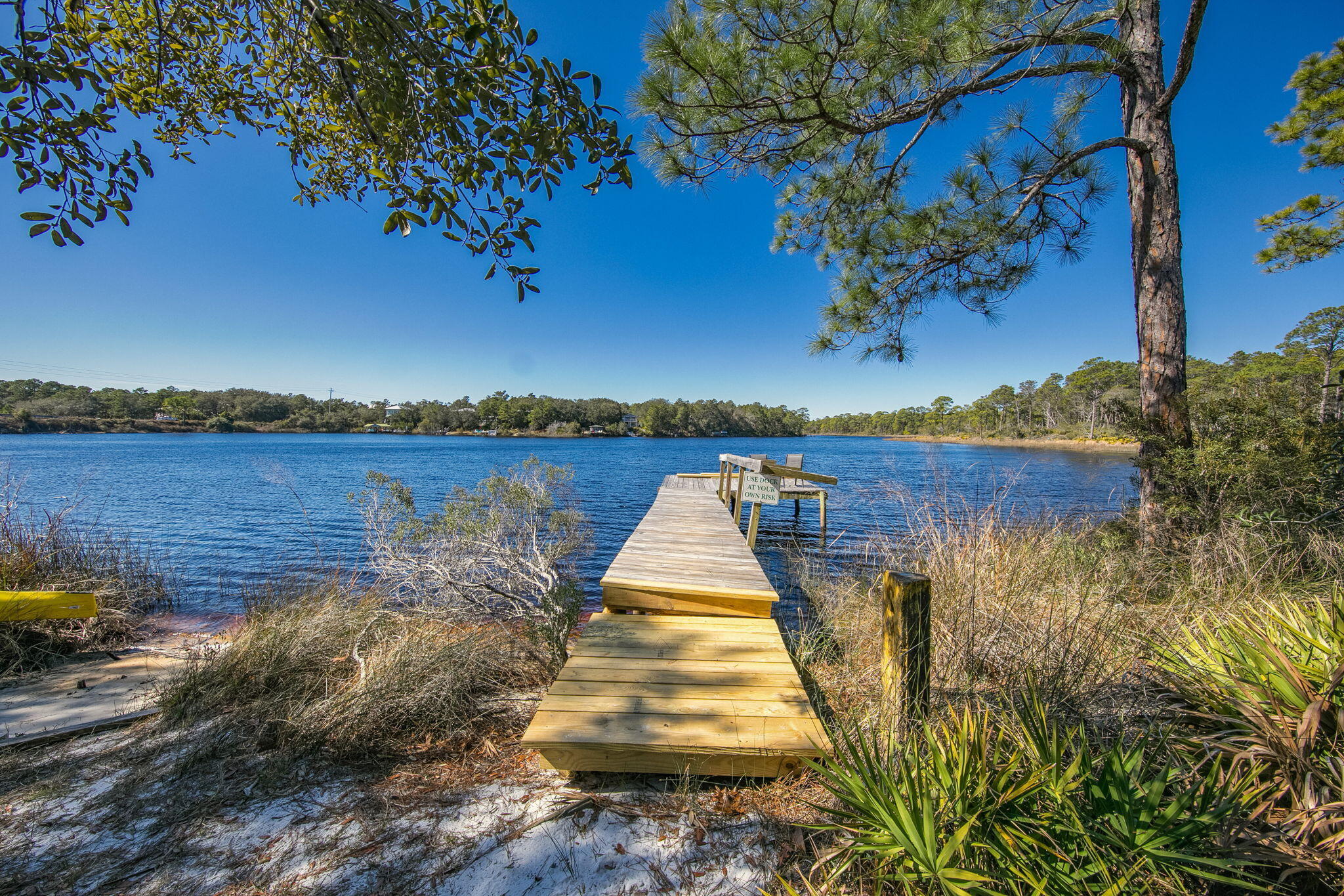 Searching for a condo near Eastern Lake on 30A with peaceful nature views and easy beach access? This second-floor 2-bedroom, 2-bath condo in Heron's Watch delivers the relaxed coastal lifestyle buyers come to 30A for. Perfectly positioned between Eastern Lake and Point Washington State Forest, the unit enjoys sweeping views of the 10,000-acre forest from the private balcony, creating a peaceful backdrop that's hard to find along the beach corridor. Even better, this unit has been completely remodeled from top to bottom--including new flooring, updated bathrooms, and a beautifully redesigned kitchen. The finishes strike the perfect light, bright coastal vibe with modern colors and style that feel fresh, clean, and move-in ready. The open living and dining area creates an easy flow for everyday living or hosting friends after a day at the beach. A washer and dryer are included, along with a private balcony storage room that's perfect for bikes or beach gear.
Outdoor enthusiasts love this location. Miles of hiking and biking trails connect just outside the community, and Deer Lake State Park is less than a mile away along the bike path, offering parking, restrooms, pavilions, and a scenic dune walkover to the Gulf.
Heron's Watch is a gated community on 30A with a swimming pool, surrounded by nature yet just minutes from the beaches, restaurants, and laid-back coastal lifestyle that make this stretch of Santa Rosa Beach so desirable.
This unit has never been used as a rental, but the location, layout, and proximity to the beach create excellent potential for short-term rental income for owners who wish to take advantage of the strong vacation demand along 30A.
If you've been searching for a 30A condo near Eastern Lake with trails, nature, beach access, and rental potential, this one is worth a closer look.