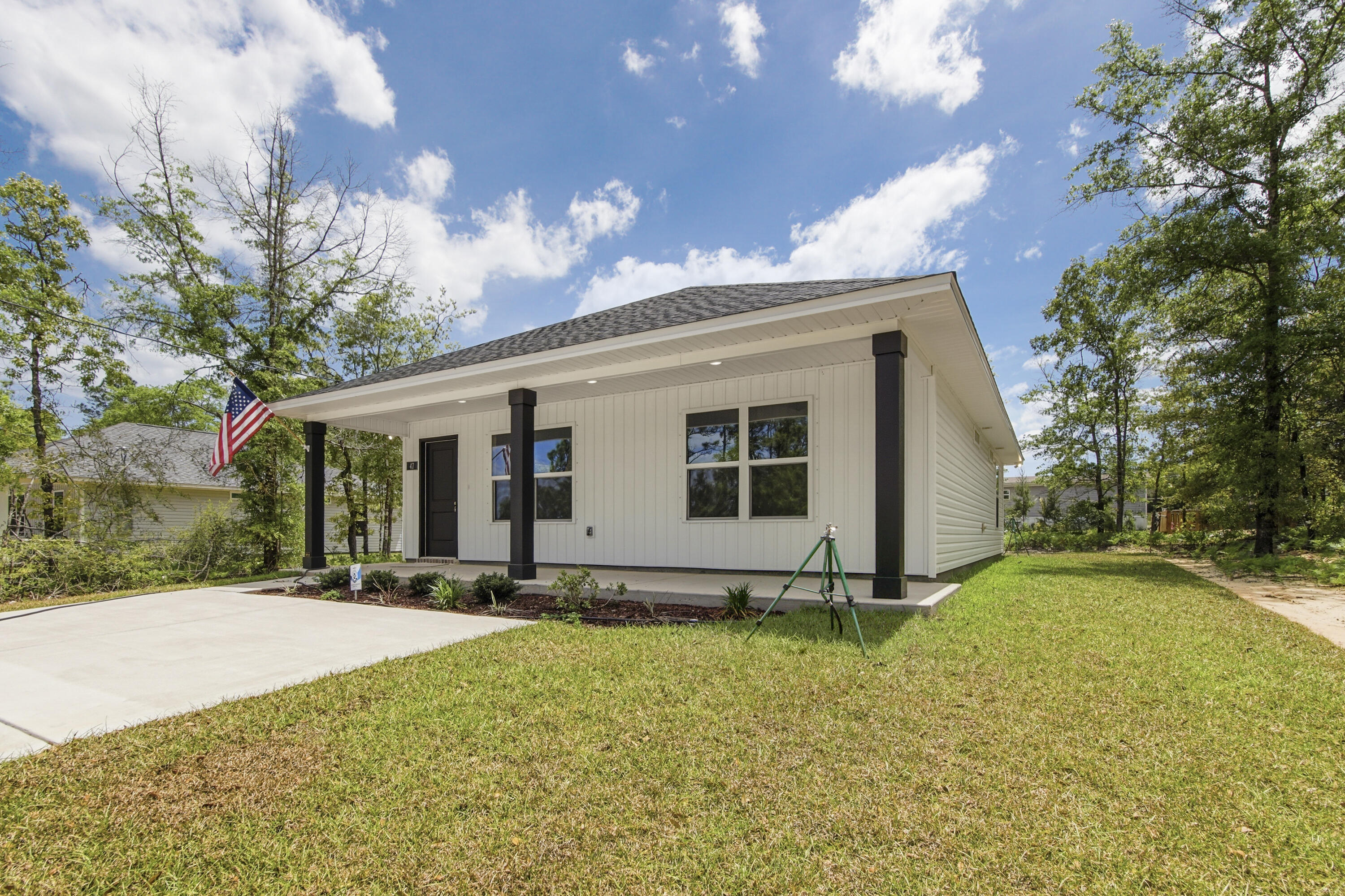 Fresh, simple, and easy to love. This newly built home by Flynn Built welcomes you with an expansive front porch, offering 2 beds and 2 baths with a light, open layout that feels comfortable and livable. Inside, you'll find durable LVP flooring, granite countertops throughout, stainless appliances and a bright, airy feel that makes the space live larger than expected. The exterior features low-maintenance vinyl siding, making upkeep easy. Also included is a one-year builder warranty for added peace of mind. Plus, with a full-price offer, buyers receive $6,000 toward closing costs, making this a super option for first-time buyers, those downsizing, or anyone looking for a clean, move-in ready start.