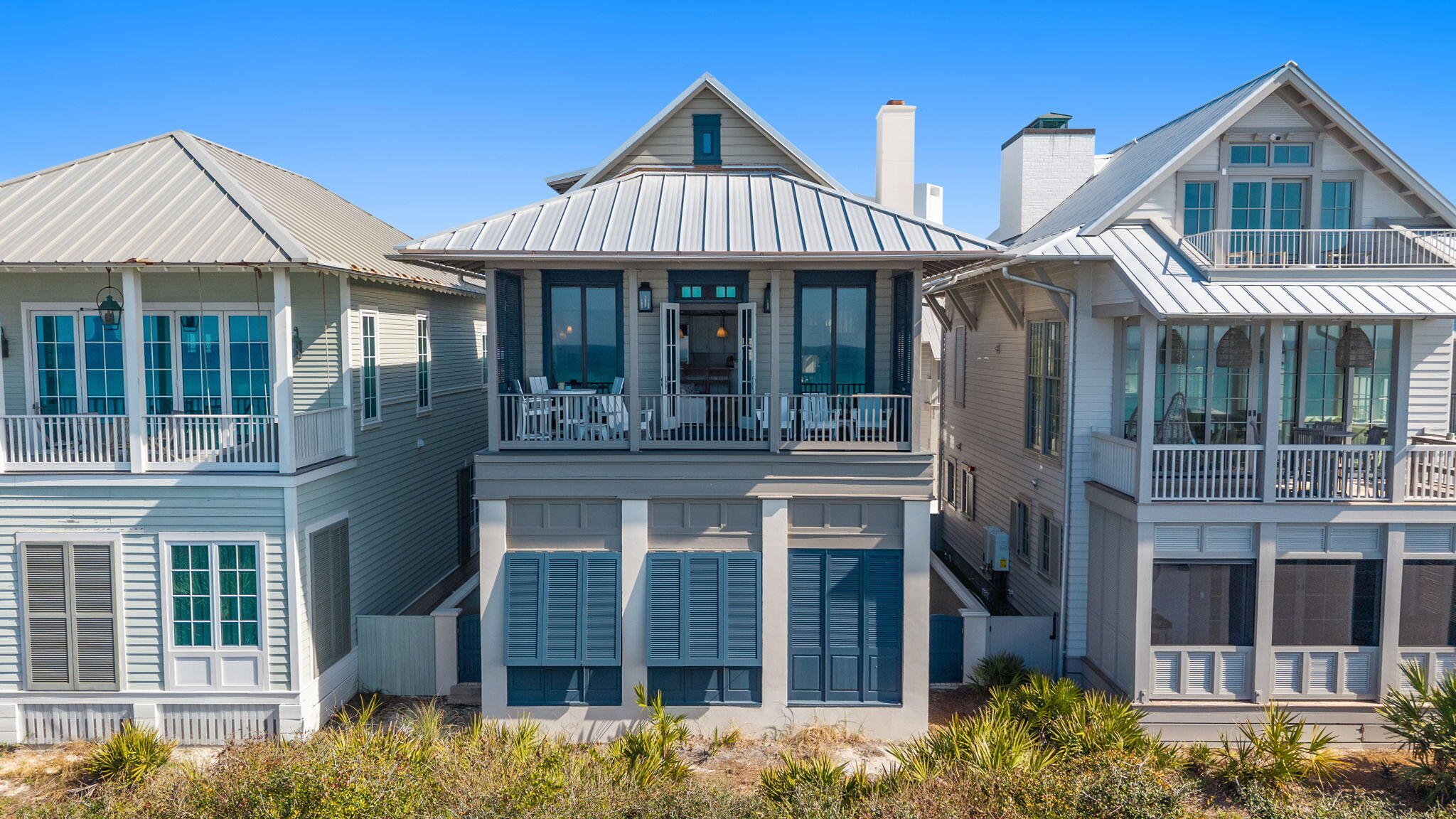 Perfectly positioned along the Gulf in the heart of Rosemary Beach, this beautifully renovated coastal retreat on Atwoods Court offers luxury design, exceptional views, and outstanding rental income. Completely reimagined with interiors by Heather Rowland of Heather Rowland Interiors, the home features all-new furnishings, designer lighting, fresh interior and exterior paint, new outdoor decking, and an updated HVAC system (2024-2025) windows and doors in 2023.
A charming private courtyard welcomes you between the main residence and carriage house, creating a peaceful entry to this elegant property.

 The first level of the main home includes two bedrooms, including a stylish bunk room with walk-in closet and ensuite bath, and a spacious primary suite with soaring ceilings, a sitting area, Bahama shutters, and luxurious bath featuring double vanities, soaking tub, tiled shower, and walk-in closet.
The second floor captures beautiful Gulf views and serves as the main gathering space with vaulted ceilings, fireplace, built-in speakers, reading nook, full bath, and an open living and dining area perfect for entertaining. The well-appointed kitchen offers bar seating, ample dining options, and convenient access to the laundry room.
The third level features an additional private bedroom suite with walk-in closet and a bathroom with double vanity and tiled shower.
Additional highlights include a two-car garage and a beautifully designed carriage house featuring a king bedroom, two loft beds, a full kitchen, and full bath AND a private balcony--ideal for guests or separate rental income property.
Located along scenic 30A and just steps from the Gulf, this exceptional property offers the perfect blend of luxury coastal living and strong investment potential.

Buyer to verify all data and dimensions.