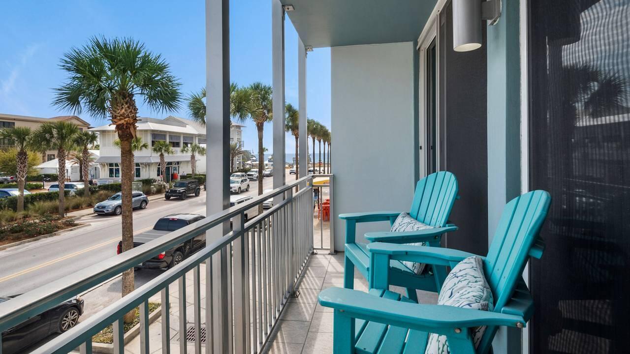 Bask in gentle Gulf breezes and enjoy views from a corner unit Juliet balcony, or take advantage of Gulf Place amenities from one of six residences at Six Palms. This two-bedroom, two-bath condo includes a private elevator and an in-unit stacking washer/dryer. Located a short walk from Scenic Highway 30A, the unit offers ample parking and comes furnished (linens excluded). Wall-to-wall sliding glass doors fill the space with natural light. The open floor plan feels larger thanks to high ceilings, light finishes, and hardwood floors throughout. The kitchen is appointed with granite counters, hardwood cabinets, stainless-steel appliances, and a tiled backsplash. The primary suite features an en suite bath with a walk-in shower and granite vanity. The guest bedroom has its own bathroom with a tiled tub/shower and granite vanity. Gulf Place living includes three pools, two tennis courts, and private beach access, plus easy access to nearby favorites like Shunk Gulley, The Perfect Pig, and the shops and cafés at the corner of Scenic Highway 30A and County Highway 393.