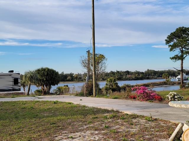 Waterfront lot that is a wow view, sunset and location.  Easy to get to Shell Island and the Gulf.  It has had major improvements since Hurricane.  New 326 ft dock with 2 boat lifts, Dock piling all new and dock raised approximately 2 ft and is extra wide for scooter, so was seawall and all of seawall redone from the water side. It has a new 6 x100 patio across water side of lot and a19x19 patio with electric and water.as well as dock.  Dock has double screws to make it stronger. There is a 3rd bay but has no lift.  It has extra pilings to tie up boats even a 55 ft boat.  Deep water.  It had tons of dirt added to lot to raise it up to the dock height.  New sidewalk.  House was removed after Michael.  House is in 3 flood zones.  House location is high and level.  House not flooded not even close and very little of yard was flooded by  Michael.  Lot was high and is now higher.  It has water, electric and sewer to lot.  Building does not convey.  This property has a front row seat to fireworks all over.   Hearing the taps at Tyndal is awesome.  Mexico beach just 20 mins away.   Buyer to verify any information that is important to them and schools