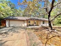 Featuring a  beautifully updated 3-bedroom, 2-bath home offers the perfect blend of privacy, comfort, and modern style.  The home welcomes you with an open family room accented by updated laminate flooring and contemporary neutral tones throughout. The renovated kitchen showcases granite countertops, ample cabinetry, and functional workspace for everyday living and entertaining.

The spacious primary suite easily accommodates a king-sized bed and includes a walk-in closet and an updated bath with a tiled walk-in shower. Two additional bedrooms are nicely appointed next to the additional two bedrooms. A finished Florida room extends the living area and offers the perfect space to relax year-round while overlooking the fenced backyard.

Situated on approximately 0.32 acres, the property includes a two-car garage, mature trees, and a quiet setting tucked away from the main roadway. Conveniently located near schools, shopping, dining, and the sugar-white beaches of Navarre, this home combines peaceful living with easy access to everything the Emerald Coast has to offer.