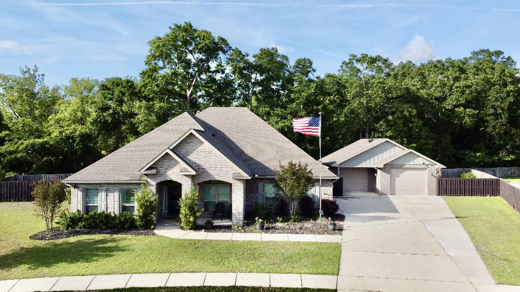 Welcome to this stunning, move-in-ready home located in the highly desirable Ashley Plantation community in Pace, Florida. Built in 2019, this spacious 5-bedroom, 3-bathroom residence offers over 3,100 square feet of thoughtfully designed living space on a generous lot.

Step inside to discover a bright, open-concept floor plan featuring high ceilings, and a seamless flow between the main living areas--perfect for both everyday living and entertaining. The chef's kitchen is the heart of the home, complete with quartz countertops, a large island, ample cabinetry, gas cooktop, and a pantry, all overlooking the expansive family room.

The split-bedroom layout provides privacy, with a spacious primary suite offering a spa-like bathroom featuring double vanities, and a tiled walk-in shower, along with a large walk-in closet. Front room has double doors to act as a home office or quiet sitting area. 

Step outside to your private backyard oasis featuring a screen-enclosed heated pool with spa, perfect for year-round enjoyment and entertaining. The property also boasts a 900 square foot+ detached 2-car garage, an oversized driveway with ample parking, and a whole-house generator.

 
Additional highlights include:

Covered patio and outdoor living space
Fenced yard with room to relax or entertain
Sprinkler system and well-maintained landscaping
Located in a sidewalk-lined community with neighborhood amenities
