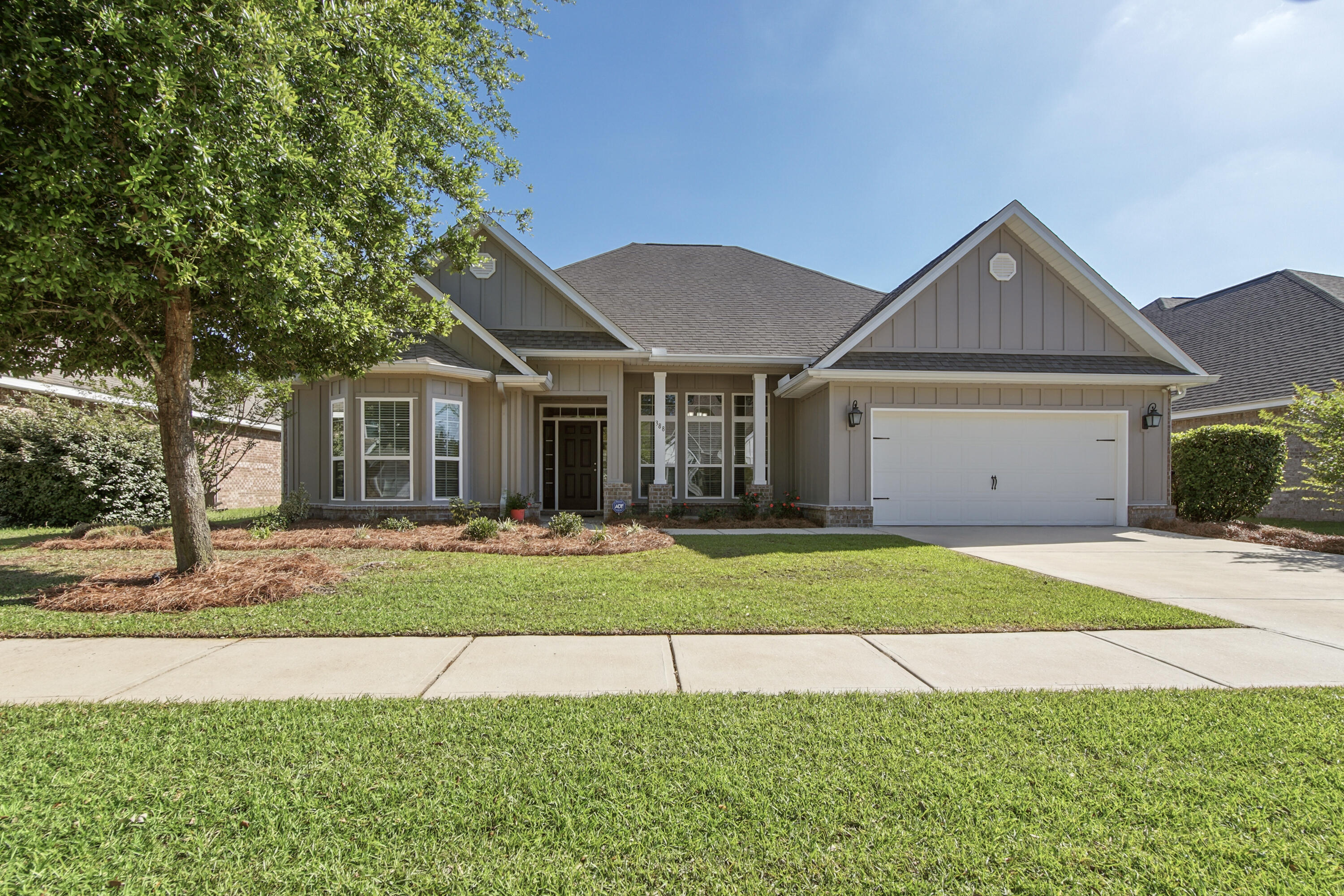 Move-in ready!! Live near the HUB of Hammock Bay...town central, green spaces, general store, pools, fitness center, brewery, etc. all within walking/biking distance. This bright & open home has a bonus room and a sunroom. The bonus room would make a great home office, music/homeschool/hobby room, etc. The sunroom is enclosed with a screen track system that can be functional in all types of weather. Enjoy the Florida breeze and sunshine in the summer with all panels open or all panels closed in the winter for a warmer room. Also, enjoy your everyday features: light colored tile floors (carpet in bedrooms only), neutral walls, welcoming foyer with a coat closet (rare in Florida), separate dining room, granite counter tops, SS appliances, gas stove, gas water heater, pull down stairs in attic, fenced backyard, new paver patio and the large backyard with room for a future pool. Put this one on your list to see soon!
