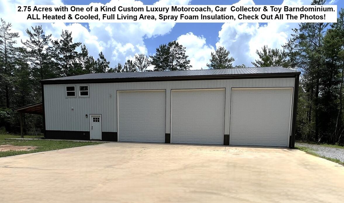 One-of-a-Kind Custom Class A Luxury Motorcoach & Toy Barn on 2.75 Private Acres. Whether you are an Automobile Collector or Boat Enthusiast this Barndominium Includes a Full Living Area with Paved Road Frontage and No HOA. This is a Dream Location only 38 Miles to Crab Island & Destin, 6 miles to Interstate 10, 43 Miles to the Gulf Beach Access on Hwy 30A, 5 miles to Blackstone Golf Course, 24 Miles to Niceville/Valparaiso - Eglin AFB East Gate, 27 Miles to 77th Special Forces Way - Duke Field, 28 Miles to Beautiful Morrison or Vortex Springs, 20 Miles to Crestview, 10 Miles to Defuniak Springs. This Barndo is COMPLETELY Heated and Cooled with SPRAY FOAM INSULATION IN THE WALLS AND CEILING OF THE ENTIRE BUILDING. The Garage Has 3 - 14 Ft Tall Insulated Garage Doors with Lift Master Garage Door Openers, Epoxy Flooring throughout the entire downstairs, 2 RV RECESSED FLOOR WASTE WATER DRAINS, Water Supply Lines, Plus 2 - 50 Amp RV Power Supplies, PEX Plumbing, Interior Metal Finished Walls and Ceiling, The Staircase Leading to the Upstairs Loft has extra storage underneath. The Staircase and Loft Railing are all Constructed of Modern Cable Railing. The Loft Area has Luxury Vinyl Flooring, and the Steps are Stained Wood. The Main Living Area Downstairs is Equipped with Shaker White Kitchen Cabinets & Bath Cabinets, Quartz Counter Tops, Glass Smooth Cook Top, Raised Bar Seating for 5-6, Living/Lounge Area, Large Bathroom with Private Water Closet, Oversized Double Vanity with Undermount Sinks, Quartz Counter Tops, Storage Closet, Extra Storage Drawers, Framed Mirrors, Walk-in Shower with Subway Tile Walls and Mosaic Tile Shower Floor, Washer &  Dryer, Laundry Sink, Tankless Water Heater, Upstairs is a Large Loft Area that is Currently a Game Room Area. There is Abundant Amount of Storage Under the Stairwell. OUTSIDE the Barndo there is an additional 50 Amp RV Power Supply, RV Wastewater Drain, & Water Supply Line. Off the Main Living Area there is a 20 x 10 Covered Porch and Outdoor Shower. The Bathroom has an Exterior Door Perfect for Quick Access without Tracking Through the Living Area. The Seller has Additional Acreage they would Consider Selling with this Property. This is Low Maintenance with an All-Metal Building with a Deep Well and is on a Septic Tank. The Location is in Walton County with No City Property Taxes and Garbage Pick Up Is a Service Provided by the County. Watson Road is Currently Approved and Scheduled to be Repaved in 2027 according to the Walton County Road Department. Please Feel Free to Contact Them Directly for More Information. Check out ALL the Photos as Some Photos Maybe Contain Descriptions of this Incredible Property. Buyer to verify schools, measurements and any information deemed important. Please check with Walton County Planning and Zoning with Intended Use as this is on the Tax Rolls as Property Usage - SINGLE FAMILY.