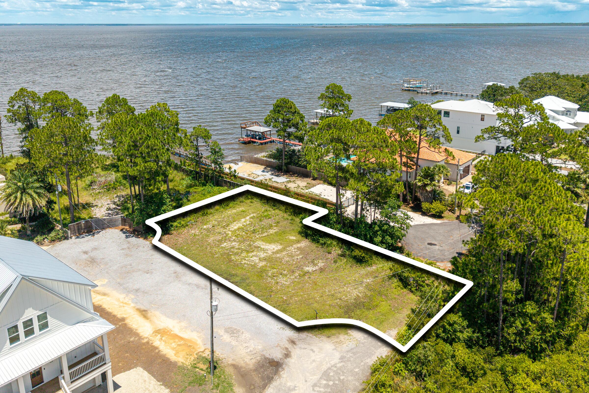 BAYFRONT VIEWS.  Build your dream coastal retreat on this exceptional homesite in the heart of Santa Rosa Beach, offering beautiful water views and an outstanding location close to the area's renowned beaches, dining, shopping, and outdoor recreation. To help streamline the building process, the property includes a thoughtfully designed set of spec plans that can be used by the new owner, saving valuable time and helping bring your vision to life sooner.

Whether you're looking to build a primary residence, a second home, or an investment property, this lot offers an excellent opportunity to create a custom home in one of Florida's most desirable coastal communities. Enjoy the best of the 30A lifestyle with convenient access to boating, fishing, paddle-boarding, and the emerald waters of the Gulf Coast.
