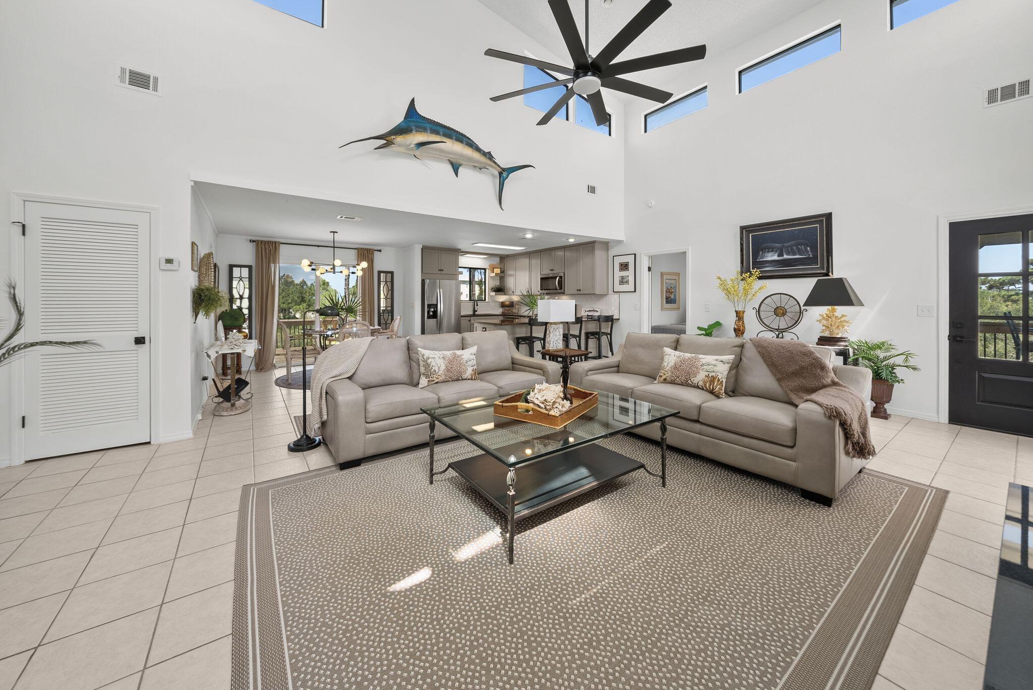 Experience luxury coastal living in this beautifully appointed first-tier bay home overlooking the crystal-clear waters of St. Joseph Bay in the highly desirable North Cape San Blas community. This exceptional residence comfortably sleeps nine and offers three beds, two bedrooms, two full baths, upscale finishes, and convenient access to both the bay and the Gulf, making it an outstanding primary residence, vacation retreat, or investment property. Rental projections are between $65,000 - $80,000 for short term rentals.

Inside, soaring vaulted ceilings and an open-concept design create a bright, spacious living area filled with natural light. Tile flooring extends throughout, while a beautiful gas fireplace provides the perfect gathering space after a day on the water. The gourmet kitchen features granite countertops, custom cabinetry, premium stainless steel appliances, a large pantry, and generous prep space for entertaining. The spacious primary suite opens directly onto a screened porch, creating a peaceful retreat to enjoy your morning coffee. The luxurious ensuite bath includes dual vanities and a beautifully tiled walk-in shower. The guest bedroom also offers direct access to the expansive outdoor living areas.

Designed for the coastal lifestyle, the home boasts massive new front and rear decks that provide exceptional space for outdoor dining, entertaining, and taking in breathtaking sunsets over the bay. An outdoor shower makes cleanup after a day at the beach or on the boat effortless. 

Built on extra-tall pilings, the home offers abundant covered parking and storage for a boat, RV, multiple vehicles, and all your fishing and beach gear. Owners enjoy access to a PRIVATE COMMUNITY DOCK on St. Joseph Bay for boating, fishing, kayaking, and paddleboarding, while Gulf beach access is just a short walk away across the street from the entrance to the road to the property. Mature native vegetation provides outstanding privacy, and the home offers excellent rental potential. 

An additional roadside lot is also available for purchase.
