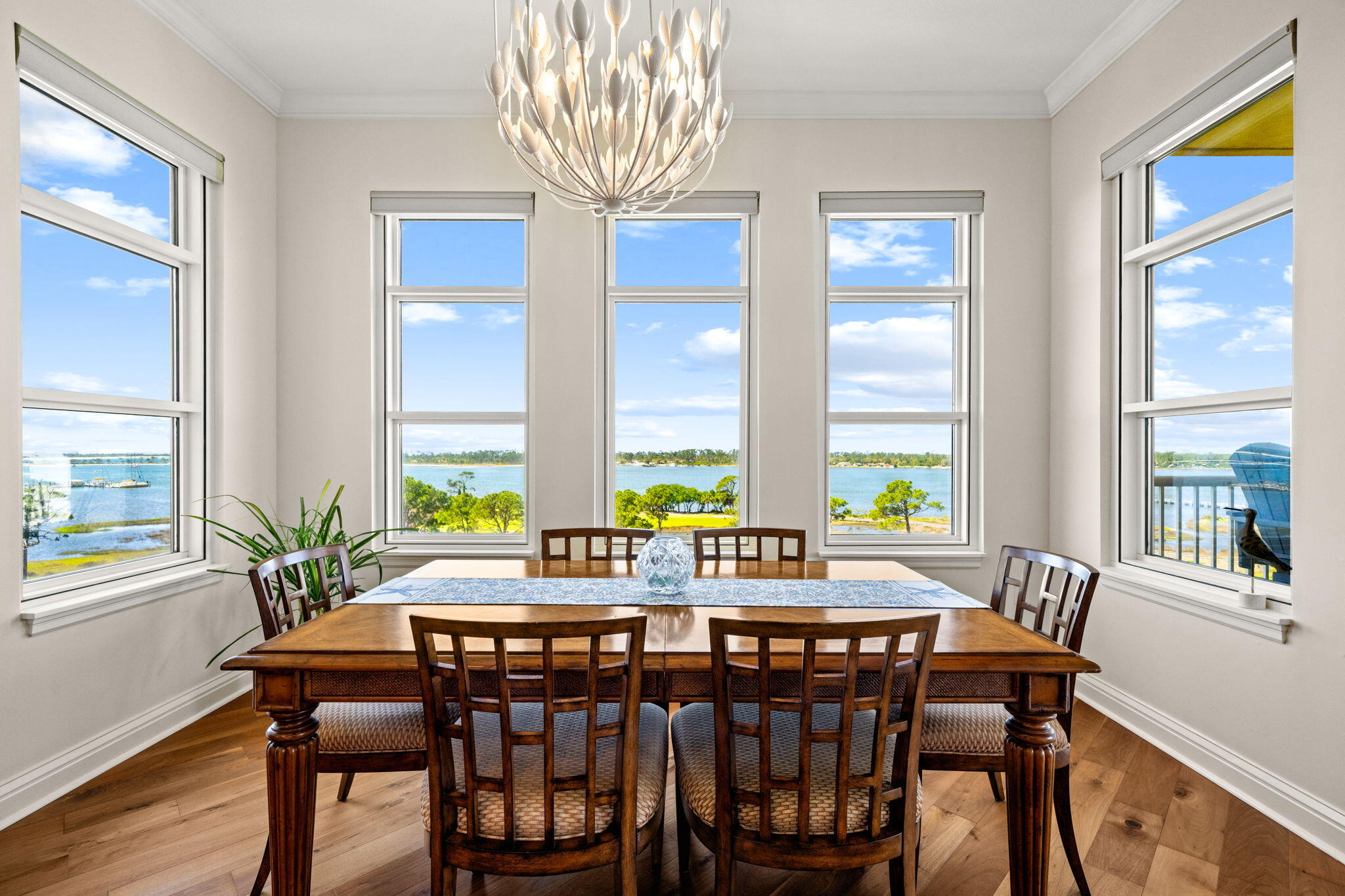 Discover the ultimate in luxury coastal living at this rare 7th-floor, 3-bedroom, 3-bath open floorplan condominium in the prestigious Grand Residences located within the exclusive and gated Bay Point Golf & Marina Resort. This exceptional condo features 10 ft ceilings with expansive windows, crown molding, and a wrap-around balcony. It has new stainless appliances, updated lighting and fans, Levolor motorized blinds throughout, new high-efficiency HVAC and water heater, and a new oversized stackable washer/dryer. The master bathroom has undergone a complete transformation with tiled shower, upgraded fixtures, frameless shower doors, and new LED lighting, The furniture, electronics, and furnishings throughout this condo are top-of-the line and most will convey. From your expansive wrap-around balcony, you overlook the Jack Nicklaus golf course, the Grand Lagoon waterway, St Andrews State Park, Shell Island, and even views out to the Gulf! You can soak in all of the amenities of this resort which include a spectacular heated swimming pool and lanai, jacuzzi, fire pit, grilling area with a smoker, fitness center, and billiards/ping pong tables, and golf cart parking, It is ideally located within minutes of the World's Most Beautiful Beach, next door to a full-service spa, and only steps to the new Point South Marina, which has slips for vessels up to 120 feet. All of this translates into a luxury coastal lifestyle unlike any other in Panama City Beach. Additionally, this condominium comes with a deeded covered parking space and a climate-controlled storage unit located just outside the 7th floor elevator doors. Schedule your showing today. All information deemed reliable but not guaranteed.