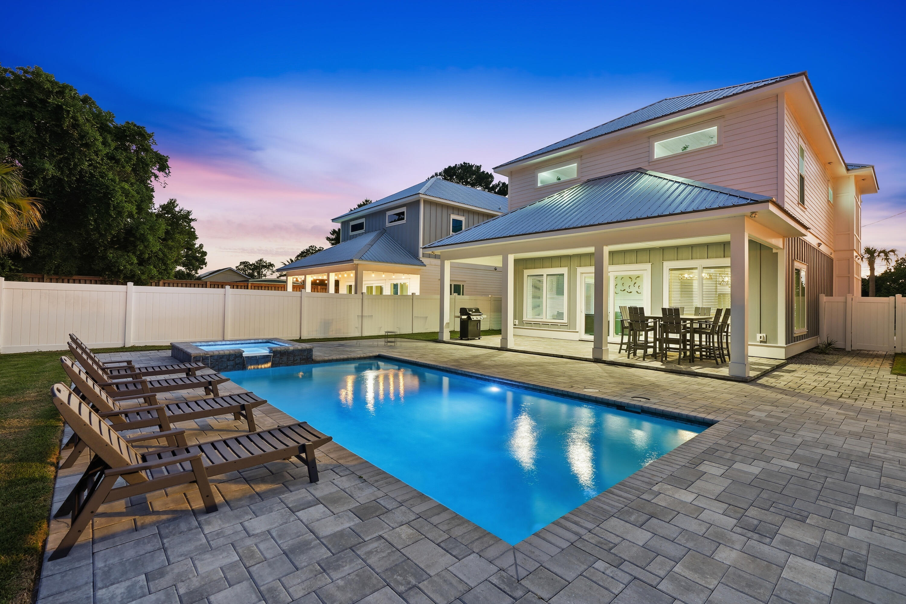 Welcome to 322 E. Lakeshore Drive, a stunning coastal retreat built in 2023 in the highly sought-after Laguna Beach community on the desirable west end of Panama City Beach. Just a short walk to the sugar white sand beaches and emerald waters of the Gulf, this beautifully designed 5-bedroom, 4-bathroom home sleeps up to 18 guests and offers an exceptional opportunity as a vacation rental, second home, or primary residence with no HOA.

The spacious open concept floor plan features a chef-inspired kitchen with an oversized island, generous dining area, and inviting living space designed for entertaining. Outside, your private backyard oasis awaits with a heated pool and spa, providing the perfect place to relax after a day at the beach.

Thoughtfully designed to accommodate large families and groups, the home offers comfortable bedrooms, additional bunk accommodations, and modern finishes throughout, making it ideal for short-term rental income.

Located in the golf cart friendly community of Laguna Beach, you're just minutes from Thomas Donut & Snack Shop, Carousel Supermarket, Pier Park, and only a short drive to the shops, restaurants, and beaches of Scenic Highway 30A.

With modern construction, luxury finishes, a private heated pool and spa, no HOA, and an unbeatable location, 322 E. Lakeshore Drive is a rare opportunity to own a turnkey beach home with outstanding investment potential and the ultimate coastal lifestyle.