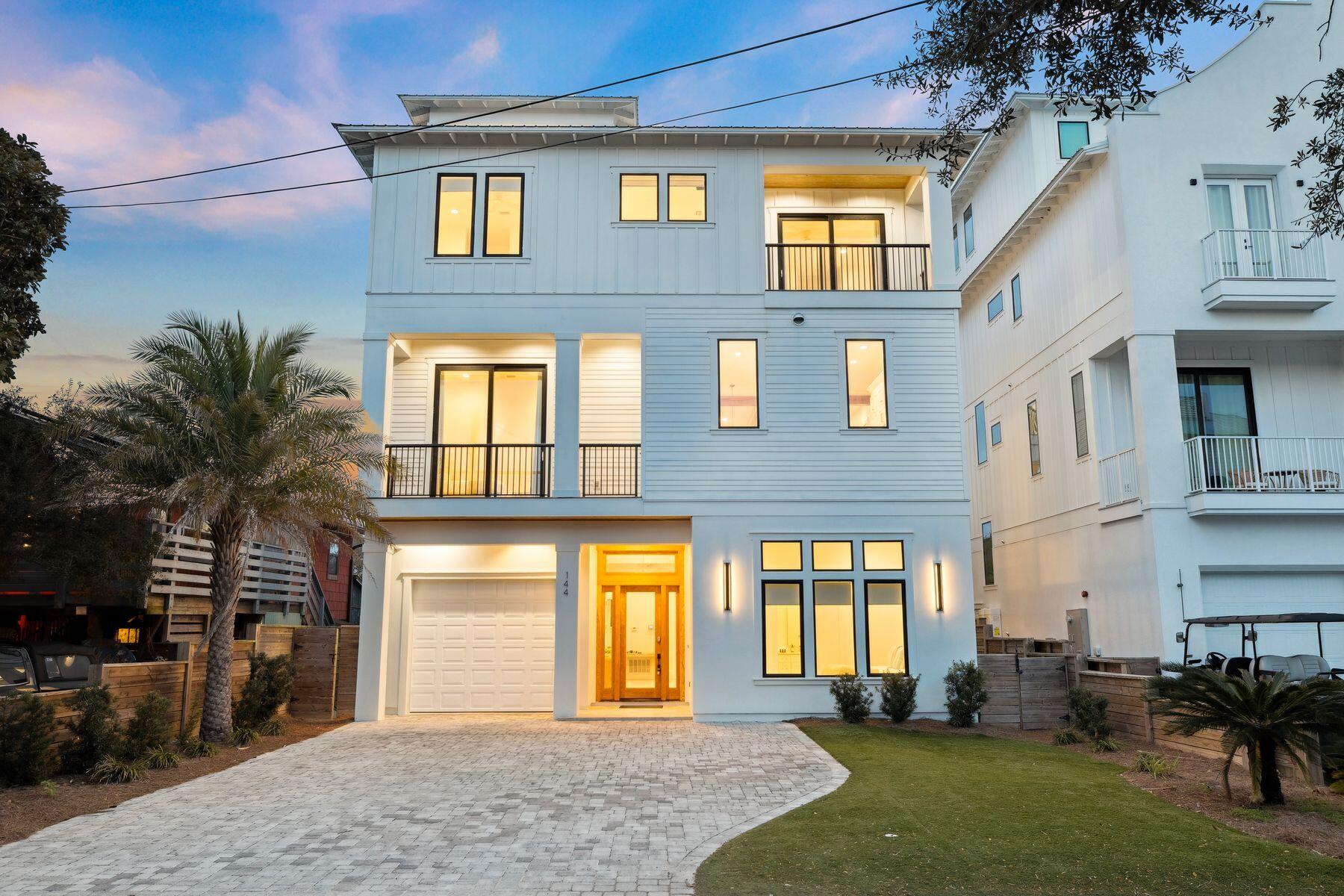 Exceptional Gulf-view investment opportunity in the highly sought-after Frangista Beach community. Completed in 2021, this luxury four-story coastal contemporary was designed to maximize both guest experience and rental income potential. With accommodations for up to 22 guests, the home is ideally suited for large family reunions, multi-generational vacations, corporate retreats, and group getaways.  The rooftop terrace delivers panoramic Gulf views, an outdoor kitchen, fire pit, and unforgettable sunset experiences. Offering eight bedrooms, eight ensuite baths, six king suites, four queen beds, and six built-in twin bunks, the spacious floor plan provides comfort and privacy for large groups. The second-floor great room features soaring beamed ceilings and a chef's kitchen with Fisher & Paykel appliances, a gas range, a wine cooler, a quartz waterfall island, large dining table and generous gathering space for entertaining he backyard features a heated pool, hot tub, outdoor kitchen, covered lounge area, and privacy fencing. The ground-level features a bedroom, bunkroom, 2 full baths, a game room with pool table, refrigerator, and wet bar. 

Additional features include a three-stop elevator, dual laundry areas, and garage storage for a vehicle or golf cart. Parking for up to 6 vehicles.  Guests enjoy gated beach access at Hollywood Street just a short walk away, along with easy access to the restaurants, shopping, and entertainment. Whether you're seeking a luxury second home or a high-performing vacation rental investment, this turnkey Frangista Beach property offers the size, amenities, and location today's rental guests demand. Sold Fully Furnished.