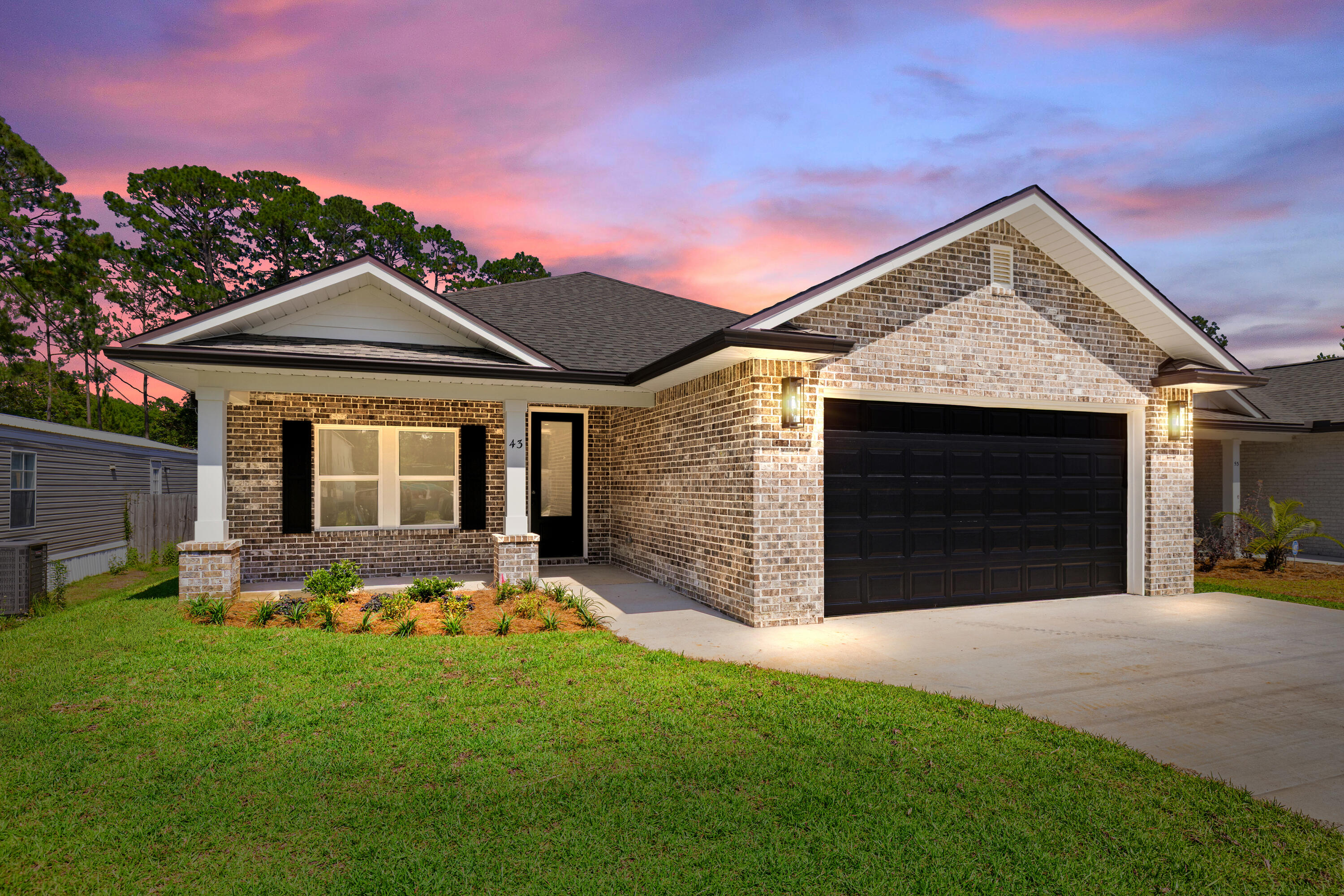 Stunning craftsmanship in this NEW construction all-brick 4-bedroom, 2-bath home. This modern home features 2040 sq.ft. with high-end custom finishes and exceptional detail. Come get settled into a neighborhood less than 2 miles East of Bluewater Bay and the Mid-Bay Bridge surrounded by new construction! This move in ready home blends timeless quality with today's most desired features, creating a home that is as functional as it is beautiful. Entering the home, you have an oversized foyer that immediately sets the tone for the custom finishes found throughout. Premium LVP flooring throughout the entire home, paired with crown molding and reverse trey ceiling with lighting, providing a seamless aesthetic.  Enter into the spacious living room with an open concept that provides an abundance of natural light with large high-impact windows, neutral finishes and modern lighting. Additional features include a floor outlet in the family room, perfect for lamps or phone chargers without obstructing walkways and the reverse trey with custom lighting with a remote providing a color choice for every season. The kitchen is a true show-stopper, designed with both style and functionality. Featuring white maple shaker cabinetry with soft-close drawers, a farm sink, white ceramic back-splash, quartz countertops, steele Whirlpool appliance package and a large walk-in pantry. The oversized 8ft island and the 6ft coffee bar add the perfect finishes! As you enter the spacious primary suite, you're greeted with natural light and you'll love the reverse trey with custom changeable lighting. Especially in the evening! The spa-like bathroom is beautifully accented with a 6ft soaking tub with shiplap accents, custom led lighting behind the mirrors with changeable colors. A custom-built full-length mirror and the spa-like shower features a built-in bench, rain head, front sprayer and a handheld sprayer conveniently placed beside the bench. Custom shelving makes the walk in closet perfect for organization. This split floor plan provides two more bedrooms and another full bath. Laundry, you will actually want to do the laundry, with a custom folding table with quartz countertop, and built-in shelving. When you want to relax, and rewind, the back yard is the place! You'll enjoy a screened in porch with ceiling fan, flood lights on each end of the house and an extra paver pad across the back of the home for a full patio set and grill. Maintenance is easily obtained with this fully sodded yard, sprinkler system that works off a separate well and a 8 ft. privacy fence with gutters installed. Theres an alley road for these homes that give an entrance to the back yard as well. A double gate has been installed on the back right side, ideal for ATV's, jet ski or a trailer. For energy efficiency, the builder has installed upgraded spray foam in the roof. You will also enjoy the storage above the garage along with the upgraded epoxy garage floor. This builder takes great pride in his homes and it shows! Five new homes are under construction. The builder is offering $10,000.00 towards the buyers closing cost, doc stamps on the deed, split title insurance and all title related fees. Restaurants, boat launch, Eglin Air Force Base, Special Forces, Emerald Coast beaches, shopping, hospitals and more are very close. Call today for a viewing, and Welcome Home