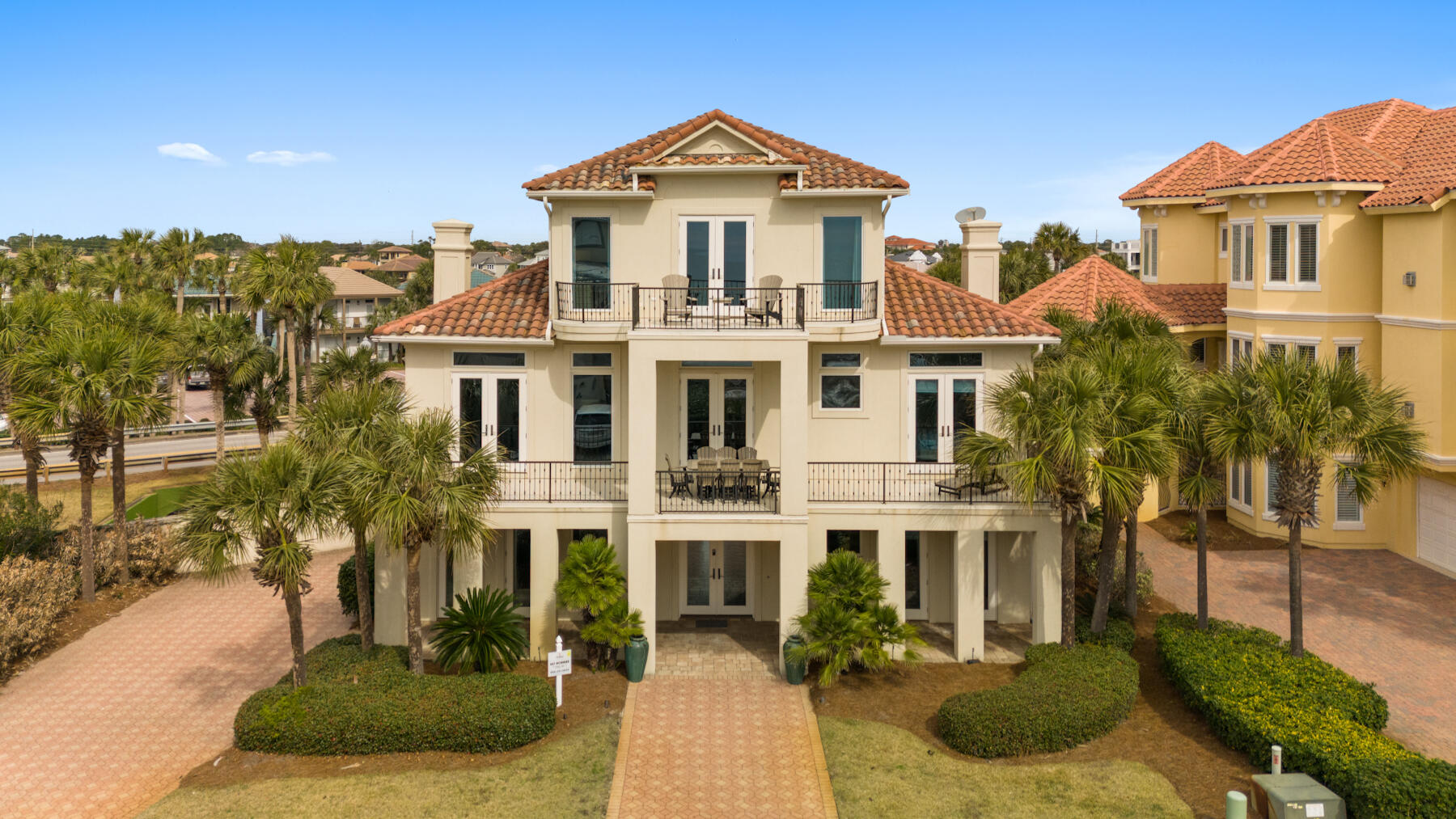 Experience luxury coastal living in the exclusive, guard-gated community of Destiny by the Sea. Just steps from one of Destin's largest private beaches, this beautifully remodeled five-bedroom, five-bath residence offers Gulf views, timeless coastal design, and exceptional indoor-outdoor living.

Thoughtfully reimagined with designer finishes throughout, the home features rich hardwood floors, pecky cypress accents, marble and oyster shell countertops, a chef's kitchen with premium Viking appliances, double ovens, dual dishwashers, and expansive living spaces designed for gathering. Multiple covered balconies invite you to enjoy Gulf breezes and stunning views, while the top-floor primary suite offers a private retreat with its own balcony and spa-inspired bath.

Perfectly suited as a luxury primary residence, second home, or high-performing vacation rental, the home comfortably accommodates large groups with bedrooms on all three levels, including custom built-in bunks and multiple guest suites.

Residents of Destiny by the Sea enjoy 24-hour gated security, a resort-style community pool and spa, beautifully maintained grounds, and private deeded beach access--all just minutes from Destin's premier dining, shopping, golf, and entertainment. This is a rare opportunity to own in one of the Emerald Coast's most prestigious beachfront communities.