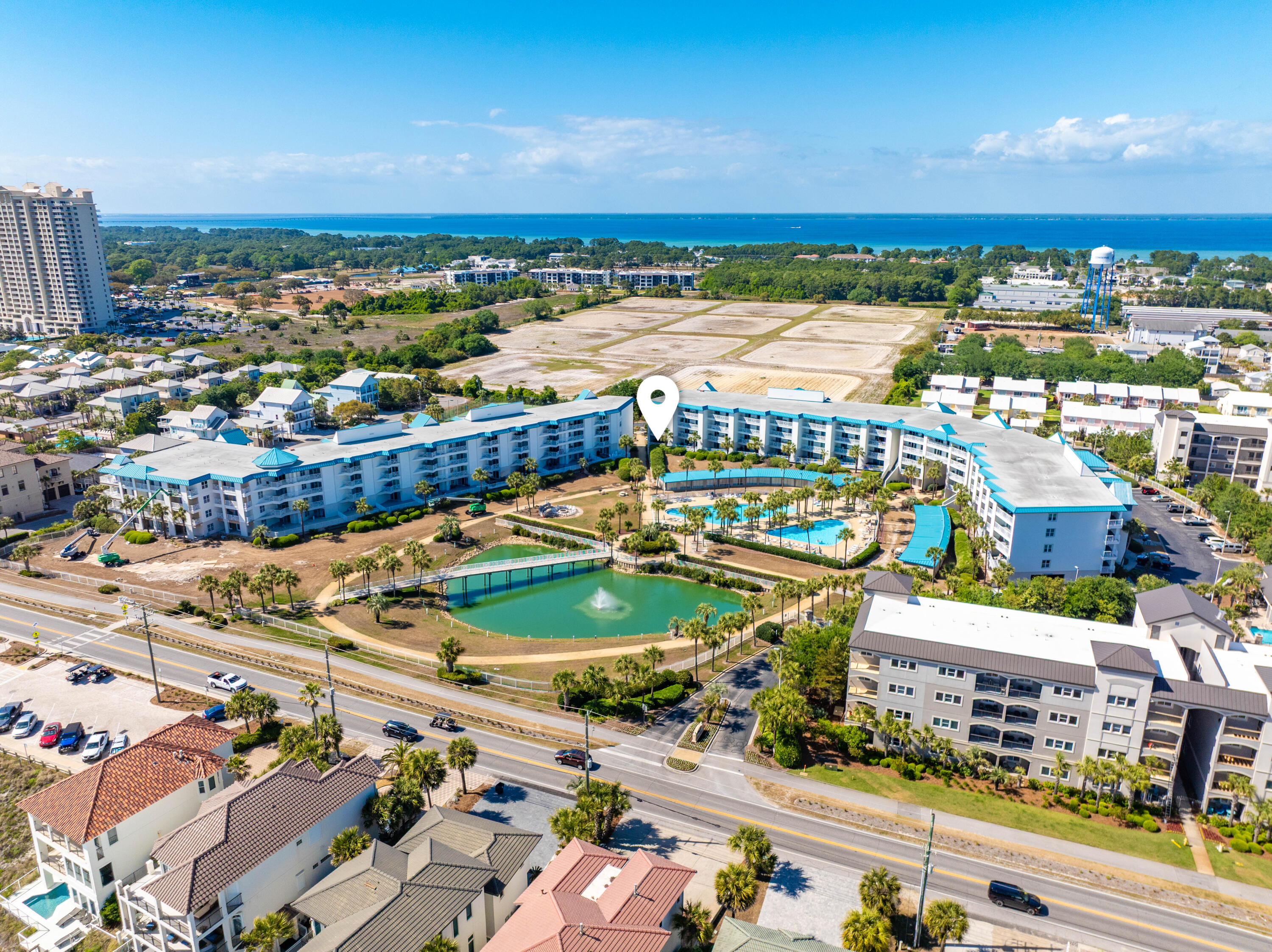 Investment opportunity. This ground-floor 2BR/2BA condo with bunk area features a spacious, thoughtfully-designed layout ideal for both personal enjoyment and rental potential. The open floor plan invites abundant natural light, creating a relaxed, coastal feel throughout. Just off the living area, an oversized private patio offers indoor-outdoor enjoyment and views of the meticulously landscaped grounds. Amalfi Coast Resort is a gated, Mediterranean-inspired community known for its lush landscaping and resort-style atmosphere. Residents and guests enjoy deeded beach access, two expansive pools, and tennis courts. Its prime location offers easy walkability to local dining and attractions, making it a highly desirable destination for both relaxation and rental demand.