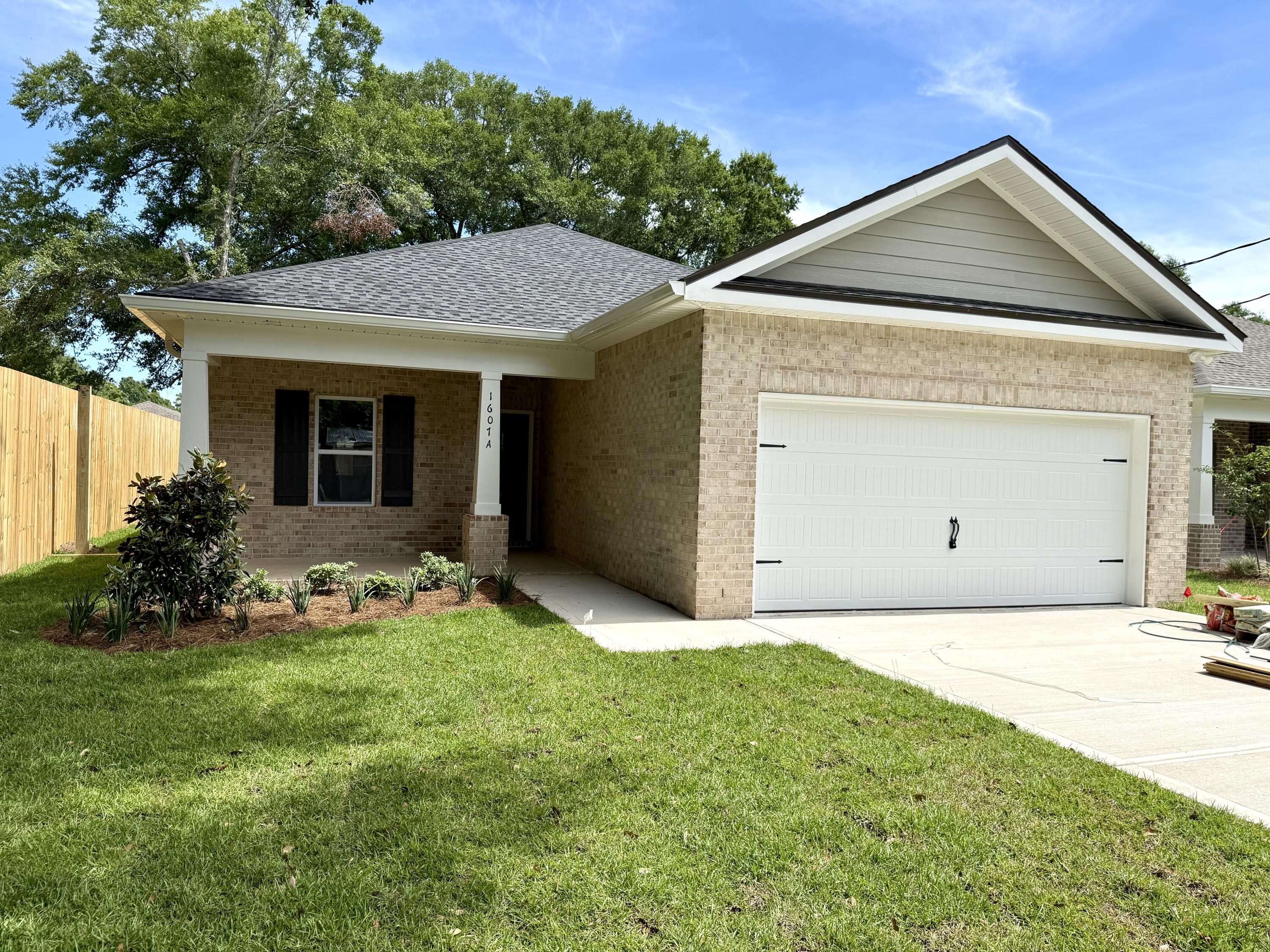 Professional Photos Coming Soon. **MOVE-IN READY** Builder is offering 3 buying options so you can choose what best fits your needs! Forget Summer cleaning! Ditch the dust rag in your old house and step into your brand new home. Builder offering $10,300 in credits to be used however the buyer would like! Centrally located in Niceville, this 4-bedroom 2-bath home offers you all of the creature comforts you'd come to expect from Grand American Homes. As you walk in, you'll notice a front dining area perfect for family meals and Holiday celebrations. The kitchen features stainless steel appliances with a pantry to fit all your kitchen needs. Unwind with a movie in your open living room before retiring to the primary bedroom/bathroom, where you can decompress in a hot shower in your tiled walk-in shower. Plenty of heads can rest in the three remaining bedrooms positioned conveniently near the hallway bathroom. Enjoy the evenings on your covered back porch overlooking your large backyard! Let's not forget that this home is conveniently located near the heart of Niceville just minutes to shopping, restaurants & parks! **The photos in this listing are from a different home with the same floor plan built by the same builder. Colors and finishes may vary.**