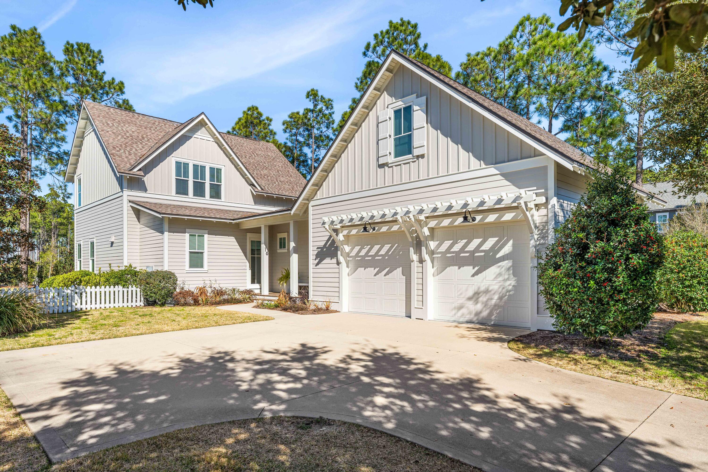 Perfectly situated on an oversized 65' x 150' corner lot in the desirable Winter Garden neighborhood of Watersound Origins, this bright and cheerful 2,748-square-foot home offers 4 bedrooms, 3.5 baths, a separate carriage house and an oversized and conditioned two-car garage with EV Tesla plug. Thoughtful interior details include custom draperies and window coverings throughout, along with designer wallpaper that adds warmth and character to several rooms. The expansive fenced yard provides exceptional outdoor space with plenty of room to add a private pool, while a screened porch with fireplace extends the living space outdoors. The separate carriage house, complete with a private entrance, small kitchenette and full bath, provides ideal accommodations for guests. Located directly across from Village Commons and convenient to the community's many amenities, this inviting home offers a rare combination of space, flexibility and an exceptional location within Watersound Origins. Home is offered unfurnished.