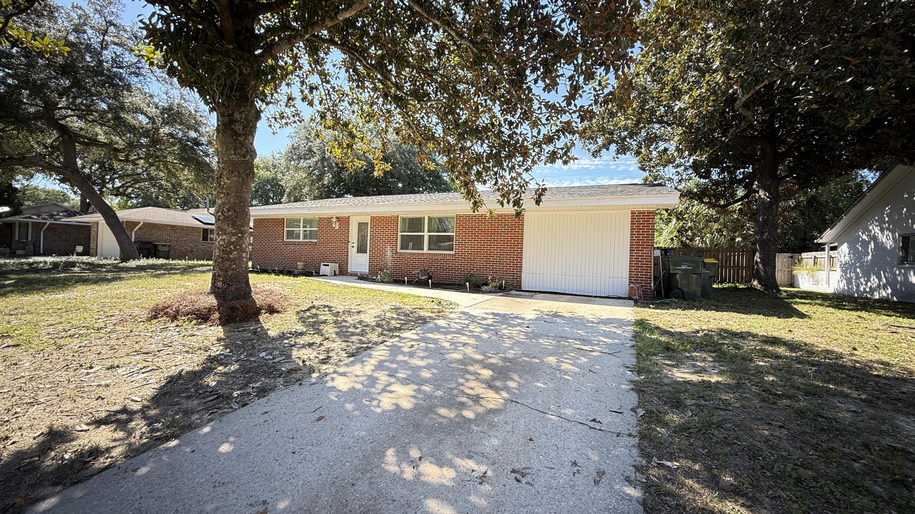 Kenwood is one of those neighborhoods buyers ask for by name & opportunities here don't come around often. Welcome to a move-in ready, 3 bedrooms/3 bathrooms, including two separate master suites--a rare layout that provides flexibility for guests, roommates, or multi-generational living. Kitchen has been updated w/new shaker cabinetry, countertops, stove, & range hood, creating a fresh, modern space that connects to the main living area & dining room. French doors lead from the dining room to a privacy-fenced backyard w/open patio ready for entertaining. Major updates: roof (2022), windows /doors (2021), HVAC (2018), sewer lines (2024), & added insulation (2023). Minutes from Eglin Air Force Base & Hurlburt Field, schools, shopping, parks, and the beaches of the Emerald Coast.