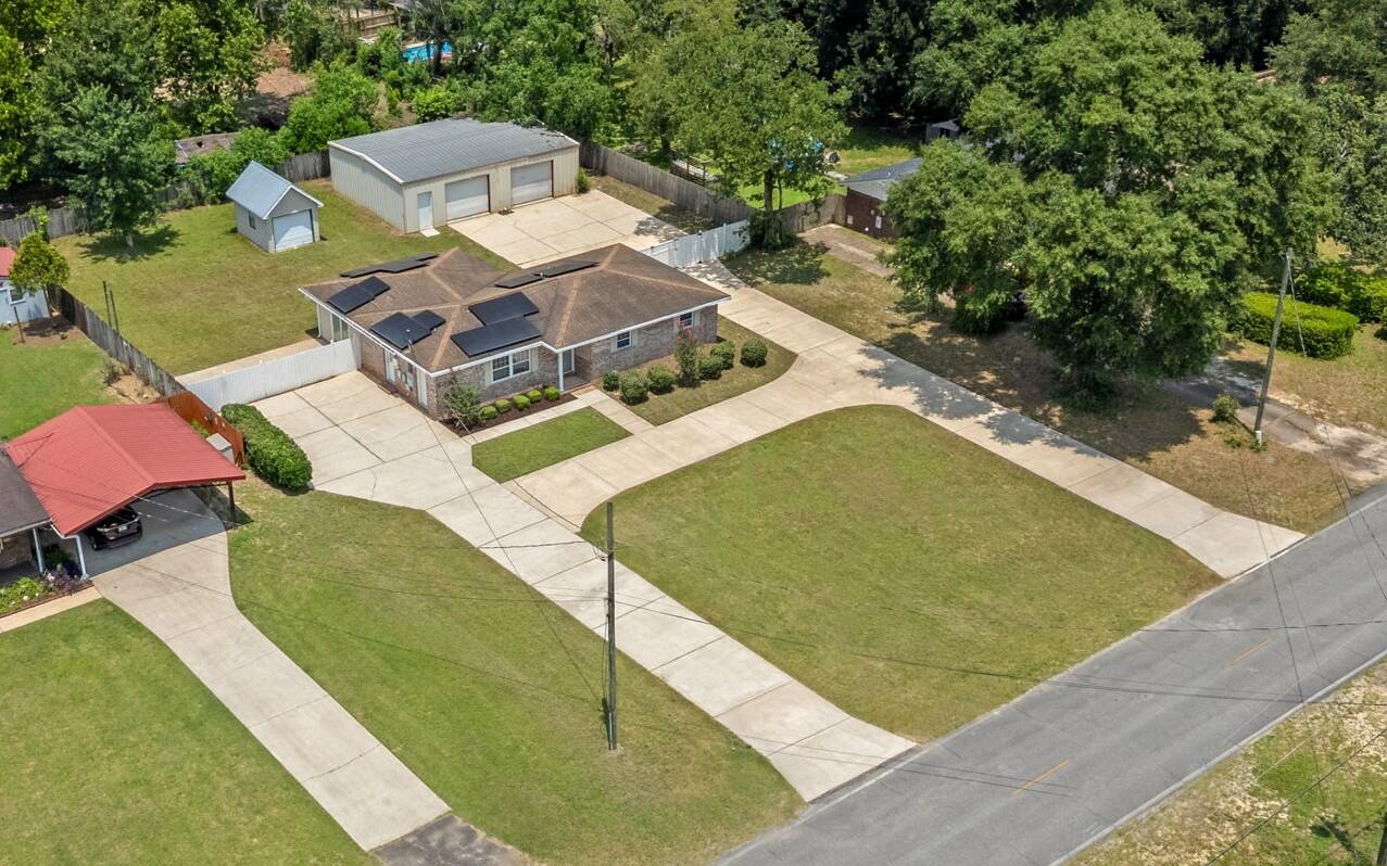 If you've been searching for a property with room to spread out, endless parking, and an incredible workshop, 1309 Valley Road is the one you've been waiting for.

Situated on a half-acre lot, this 3-bedroom, 2-bathroom home offers 1,680 square feet of living space with features that set it apart. The circular horseshoe driveway and oversized parking area provide ample room for cars, trucks, RVs, boats, trailers, and more.

The impressive 1,200-square-foot metal shop is a dream for hobbyists, mechanics, small business owners, or anyone needing extra workspace and storage. An additional detached garage provides even more room for tools, lawn equipment, or seasonal items.

Inside, you'll find new flooring throughout and a spacious living room with durable tile flooring, creating a comfortable space to gather with family and friends. Step outside to enjoy the fully fenced backyard, offering privacy and plenty of room for kids, pets, or entertaining.

To top it off, the seller is offering a new roof with an acceptable offer, adding even more value and peace of mind for the next owner.

Properties with this much outdoor space, parking, and workshop potential are hard to find. Don't miss your chance to make 1309 Valley Road your next home!