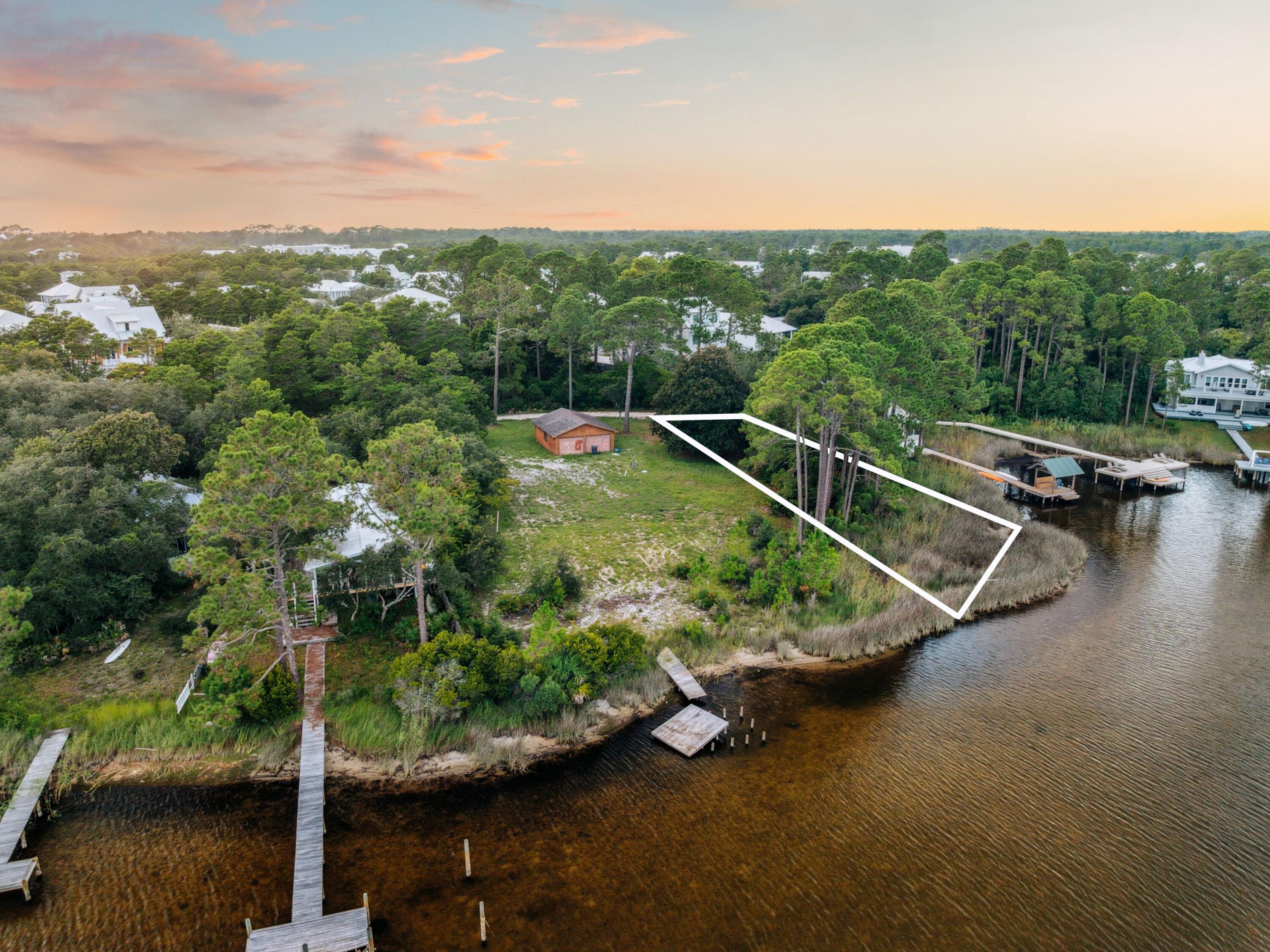 A rare opportunity to own a premier lakefront homesite on iconic Eastern Lake, Lot 9 offers a serene blend of privacy, natural beauty, and refined coastal living just south of Scenic Highway 30A.

Gently positioned along the water's edge, this homesite captures tranquil lake views framed by mature greenery and a peaceful, tucked-away setting. One of the area's rare coastal dune lakes, Eastern Lake offers direct access to paddleboarding, kayaking, and boating--creating a unique connection between calm freshwater and the Gulf beyond. Located in the eastern corridor of Seagrove Beach, the property is just moments from the shops, dining, and coastal charm of Seaside, Alys Beach, WaterColor, and Rosemary Beach, while maintaining a sense of quiet retreat.

For those seeking to expand their vision, the two adjacent lakefront lots are also available, presenting a unique opportunity to create a private compound or legacy property in one of 30A's most desirable settings.

Thoughtfully positioned and rich in natural surroundings, Lot 9 offers an exceptional canvas to build a custom residence that embraces both lifestyle and location.