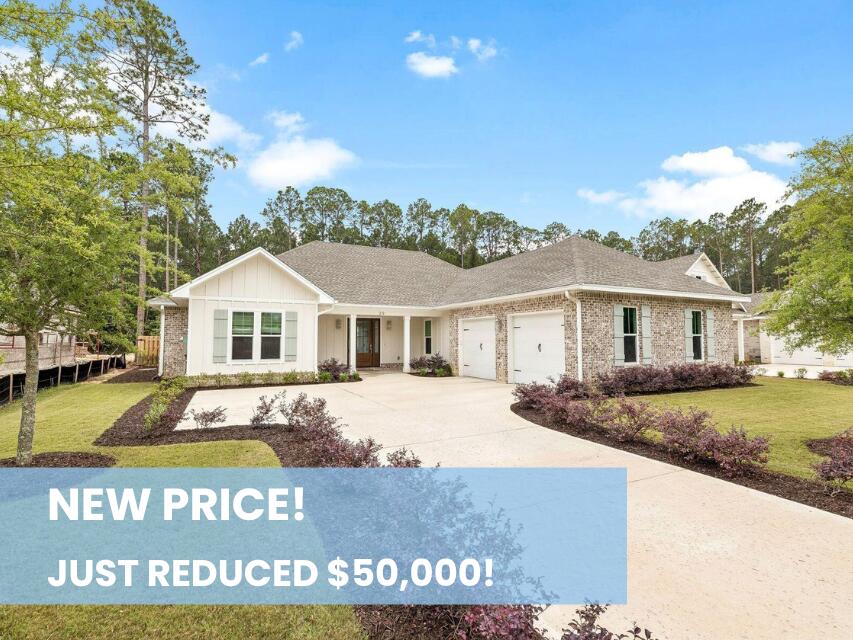 Tucked within the gated bayfront community of Steamboat Landing at Hammock Bay, this thoughtfully designed, CUSTOM, single-level residence offers an exceptional combination of privacy, functionality, and indoor-outdoor living. Positioned on a large homesite backing to a serene wooded buffer, the property enjoys a peaceful setting with a spacious fenced backyard designed for both entertaining and everyday enjoyment. Beautiful landscaping and a welcoming approach set the tone upon arrival, while the attached two-car garage and well-planned layout provide effortless convenience. The expansive backyard is a standout feature, complete with a large paver patio and grilling area, dedicated fire pit space, and an oversized screened porch with ample room for both dining and lounging, all overlooking the private natural backdrop. Inside, the home's flowing floor plan was designed with both comfort and connection in mind. A welcoming foyer opens into the spacious living room, anchored by a built-in brick fireplace, before seamlessly transitioning into the dining area and stunning kitchen beyond. The kitchen serves as the heart of the home with a large center island, gas range, range hood with natural wood accents, neutral tile backsplash, and an oversized walk-in pantry. Large windows throughout the living, dining, and kitchen spaces create a bright and inviting atmosphere while offering uninterrupted views of the backyard and wooded surroundings. Positioned at the rear of the home for maximum privacy, the primary suite overlooks the backyard and wooded buffer and features dual vanities, a walk-in shower, and a spacious walk-in closet. Two additional guest bedrooms each include walk-in closets and share a Jack-and-Jill style bathroom, while a separate powder bath adds convenience for visitors. Privately situated off the kitchen, a mudroom hallway and laundry area connect to a secluded fourth bedroom featuring its own ensuite bath and generous walk-in closet, ideal for guests or multigenerational living. Residents of Steamboat Landing at Hammock Bay enjoy an amenity-rich lifestyle with access to the expansive community offerings. Steamboat Landing provides a more intimate bayfront setting complete with a waterfront clubhouse, dock, and picturesque walking trails shaded by mature oak trees. Hammock Bay further enhances the lifestyle experience with multiple pools including two zero-entry resort-style pools, a traditional lap and recreation pool, a state-of-the-art 10,000-square-foot fitness center, more than 12 miles of trails and bike paths, playgrounds, lighted pickleball and tennis courts, and a basketball court, the popular Props Brewery, and a community amphitheater.