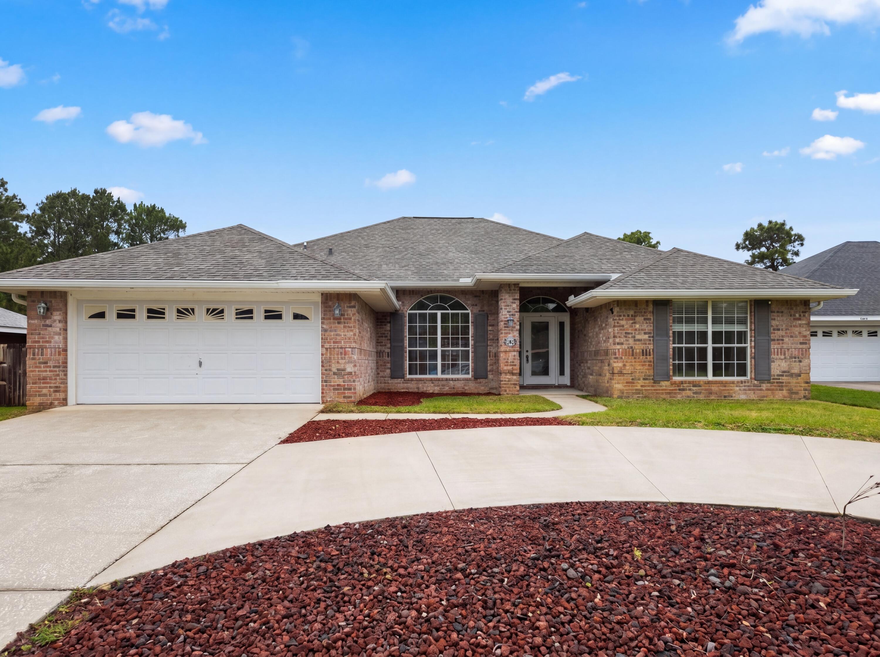 Explore 9564 Pouder Ln, featuring new hvac and partial flooring replacement. A fireplace highlights the living space; the kitchen contains all stainless steel appliances. The primary bedroom includes a walk in closet, and its bathroom provides double sinks plus a separate tub and shower. A patio connects to a fenced in backyard. This home presents practical updates for comfortable living.