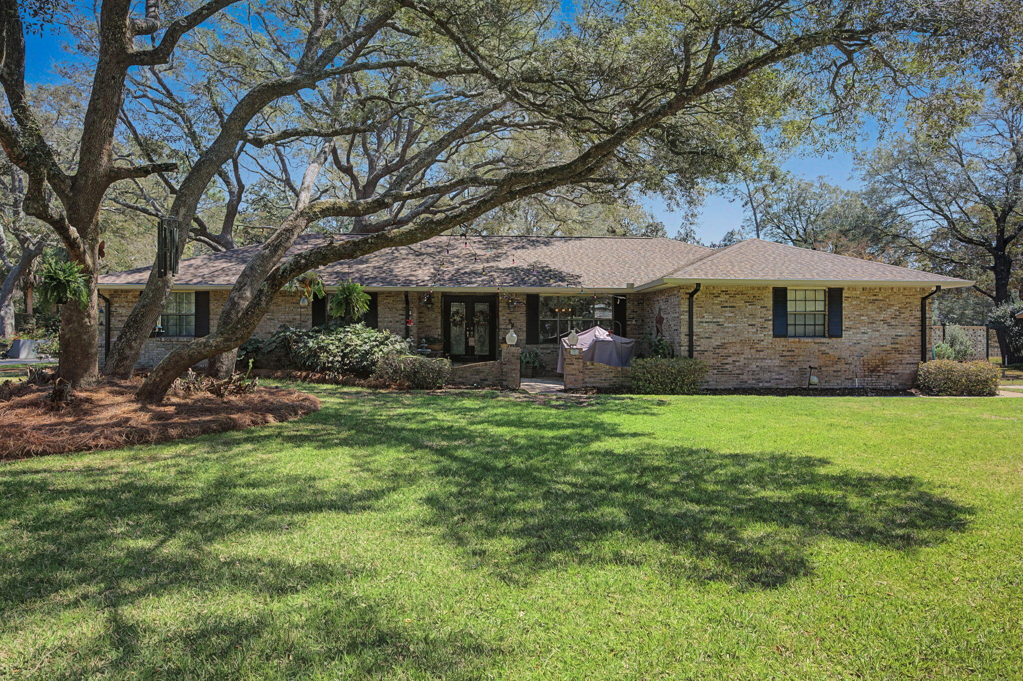 Homes with this much land, character, and golf course frontage don't come along often! You must come see this custom one-story ranch tucked away on a beautifully landscaped half-acre lot overlooking the 6th green of Rocky Bayou Country Club Golf Course. This property offers a rare combination of space, privacy, and location! From the moment you arrive, the mature Live Oak trees and lush landscaping set the tone for a property that is established, peaceful, and inviting.  Inside, the 3-bedroom, 2-bath home features tile flooring through most of the living areas and a thoughtfully updated kitchen with stainless steel appliances and modern finishes designed for both everyday living and entertaining. Once a one-car golf cart garage has been transformed into a huge pantry and wine tasting room. So many favorite spaces is this home one being the bright Florida room--perfect for enjoying morning coffee, relaxing with a book, or simply taking in the beauty of the backyard and Florida sunshine year-round.
Outside, the half-acre property is a gardener's dream, complete with mature landscaping, blooming plants, and a sprinkler system supplied by a well to keep the grounds thriving. The property also features a large two-car garage, offering incredible flexibility for hobbies, storage, or projects.
Recent improvements include a full interior repaint and a new garage door and opener in 2024, along with previous upgrades such as a renovated kitchen and bathrooms and a cozy gas fireplace.
Located in the private Le Chateau neighborhood with golf cart access to Rocky Bayou Country Club, this home is also just minutes from Eglin Air Force Base, Duke Field, the 7th Special Forces Group, and the EOD Naval School. Also conveniently located close to highly rated schools, shopping, and Destin beaches. Come see what makes this property so special.