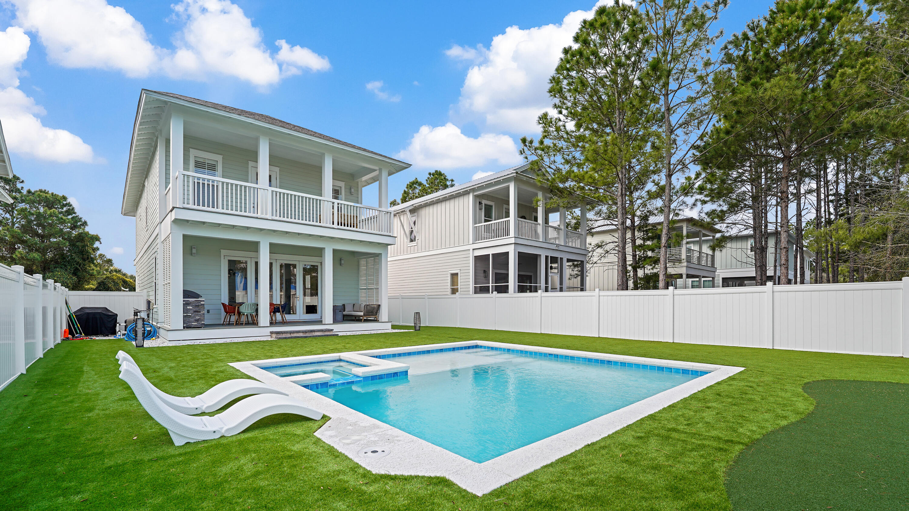 Tucked away on a private street in the heart of Seagrove Beach, 65 Sand Dollar Court presents a rare opportunity to own a fully furnished, never-rented coastal retreat just moments from the beach access.
This owner-occupied residence exudes quality and sophistication, featuring rich hardwood flooring throughout, thoughtfully designed ensuite bathrooms, and timeless plantation shutters that elevate both style and privacy. Every detail reflects pride of ownership and a level of care seldom found in today's market.
Step outside to a truly exceptional backyard oasis--fully fenced for privacy and designed for both relaxation and entertainment. Enjoy a brand-new heated in-ground pool, low-maintenance turf, and a custom putting green, creating a resort-style experience that appeals to all.