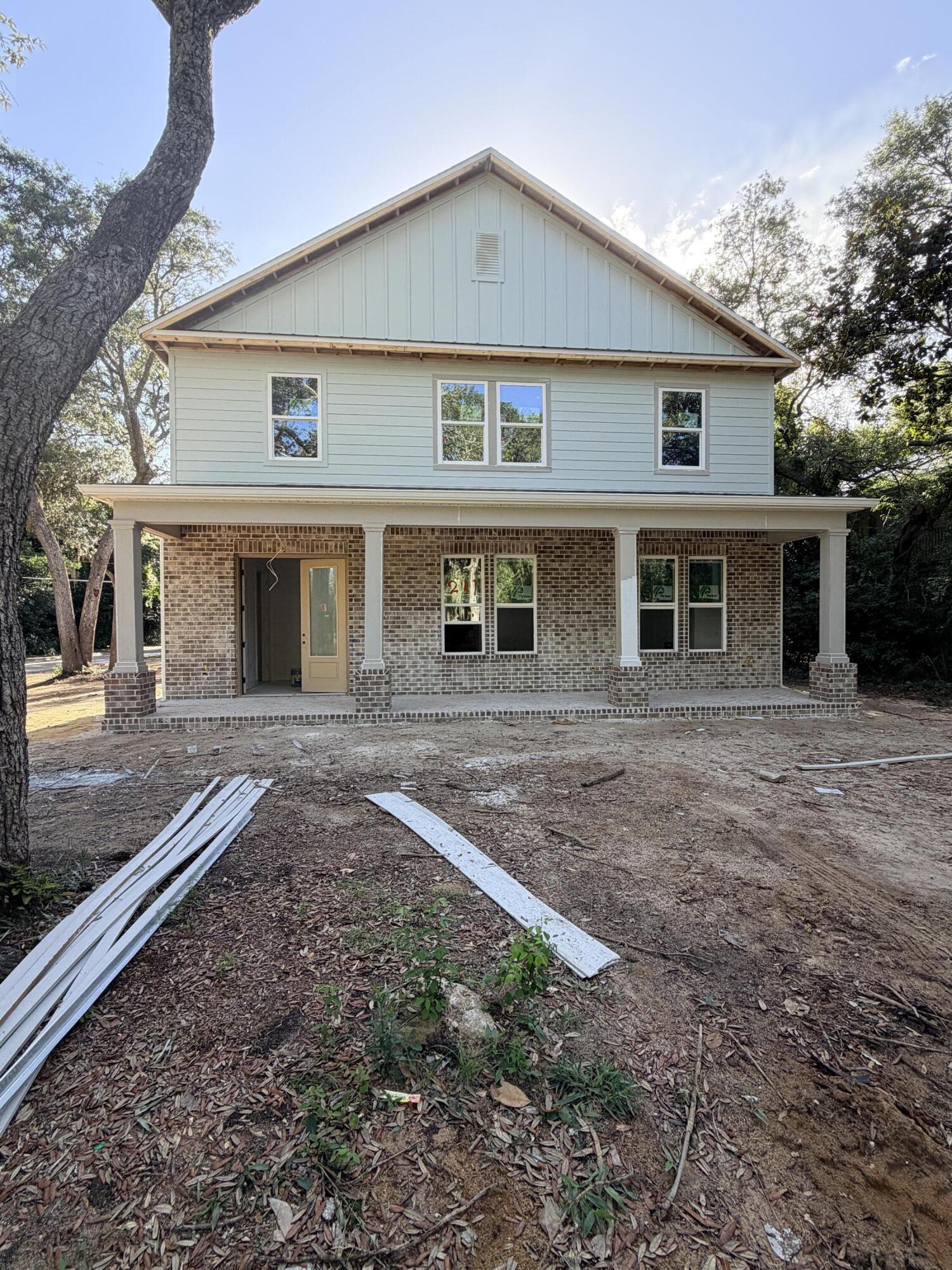 Under construction- can close August 30th! New-construction opportunity in Valparaiso! Be the first to own this stunning, soon-to-be-built coastal masterpiece, located at 241 Grandview Avenue. Offering an impressive 3,458 SQ FT of heated and cooled living space, this masterfully designed floor plan delivers unmatched modern comfort just moments away from Niceville, the Tom's Bayou bridge, and the waterfront. Step into a sprawling lower floor built for upscale living and effortless entertaining. The vast, open-concept living room provides a grand sanctuary, while a separate front office and a flexible study/bedroom 1 cater perfectly to your remote work or guest-hosting needs. Holiday gatherings are easily accommodated in the dedicated formal dining room. Tucked away at the rear of the main level for maximum privacy is the luxurious owner's suite, boasting a massive walk-in closet and a spa-like bath complete with a double vanity, standalone shower, and deep soaking tub.

Head upstairs to discover an oversized laundry room and four additional large bedrooms, ensuring absolute comfort and personal space for a growing family or multi-generational living. Storage is never an issue with a sprawling 600 SQ FT garage ready for all your coastal gear, vehicles, and water toys. Buyers can reference the floor plan in the MLS documents. Don't miss this rare chance to claim your dream coastal estate! Estimated completion date Mid August.